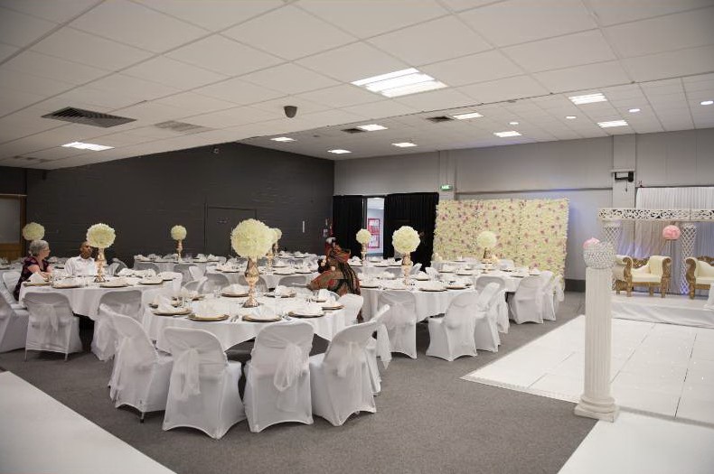 Elegant Masefield Suite venue with round tables, perfect for weddings and formal events.