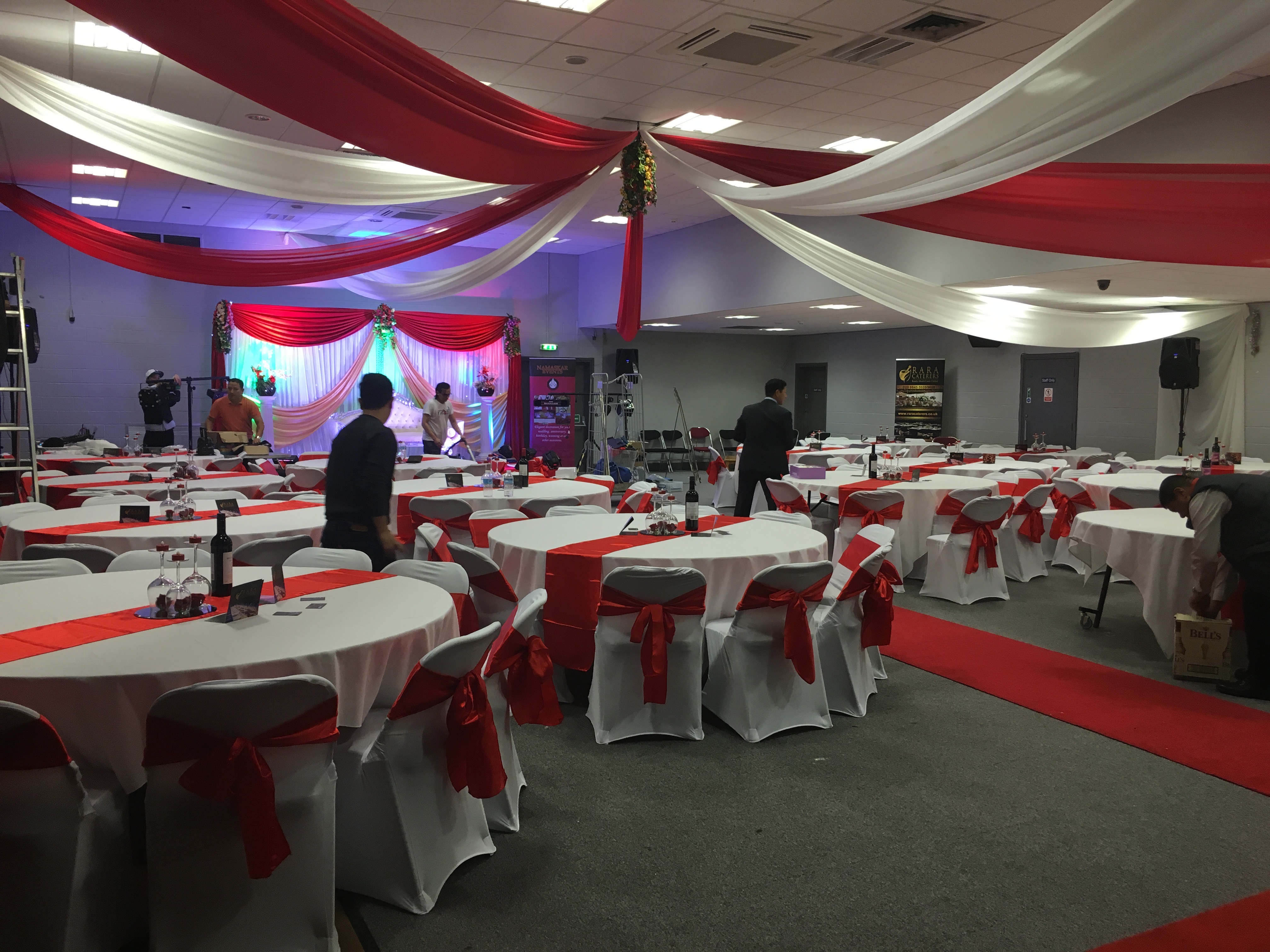 Elegant Masefield Suite venue with round tables, ideal for corporate events and celebrations.