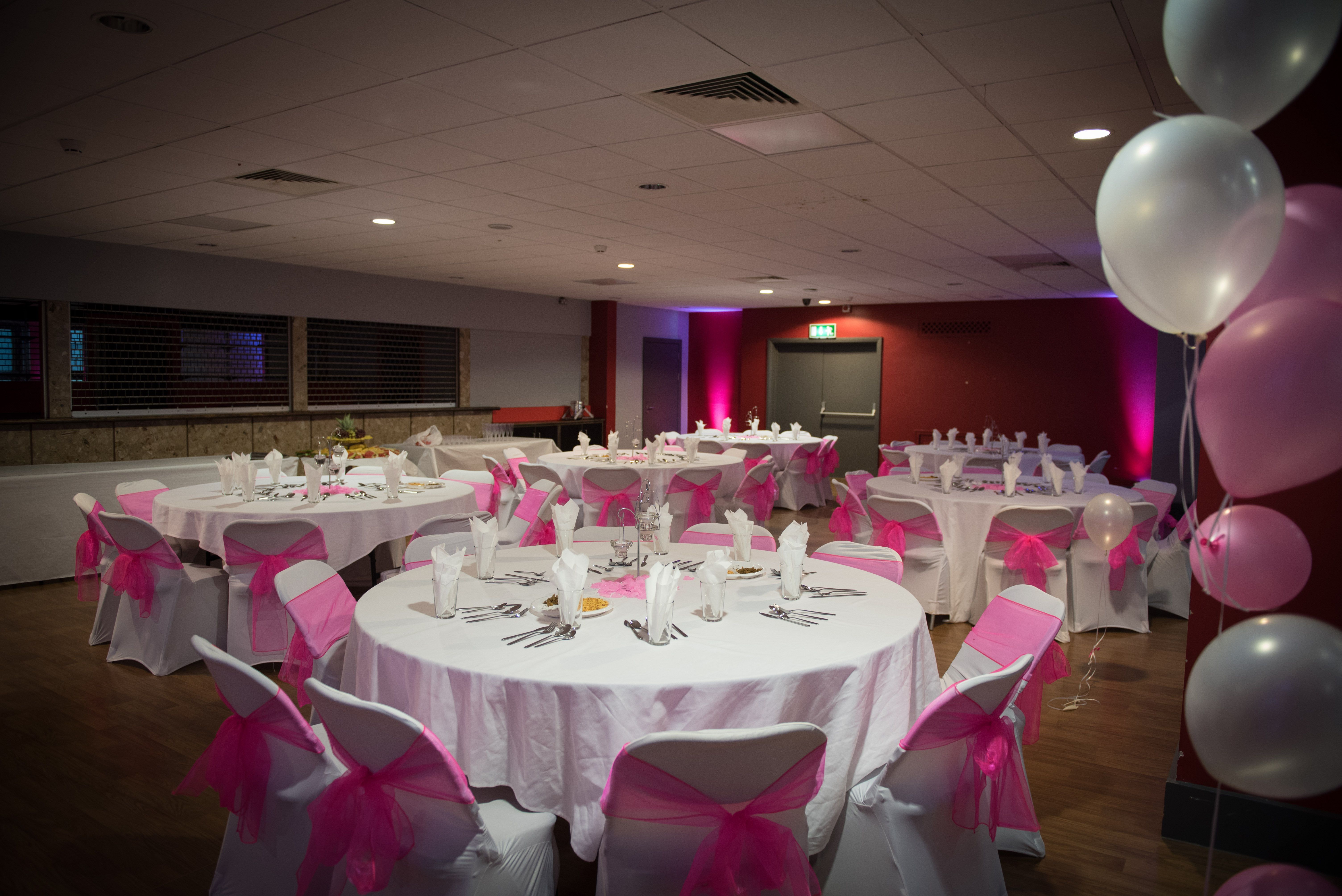 Elegant Masefield Suite venue with round tables, perfect for weddings and formal gatherings.