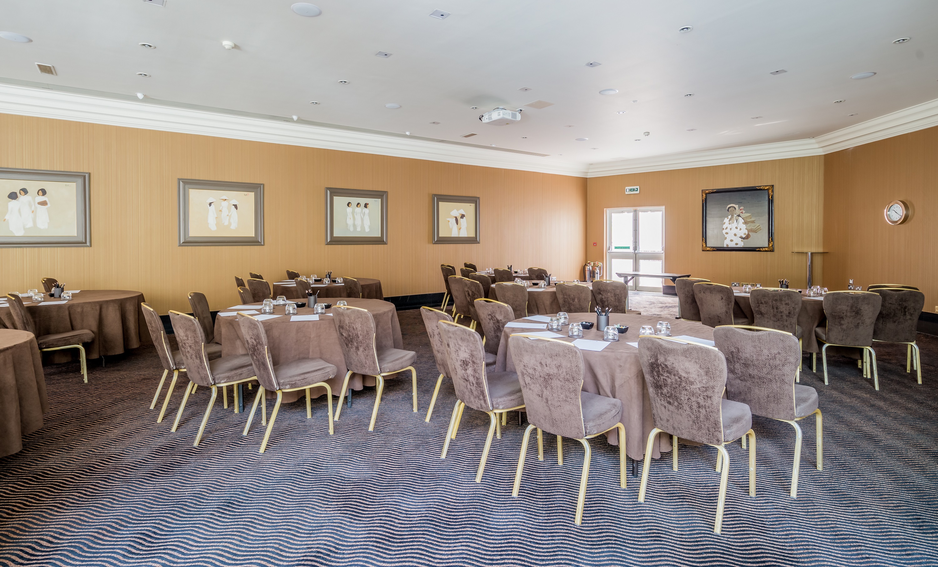 Newbury Suite 2 at Radisson Blu Heathrow, elegant meeting space with round tables for events.