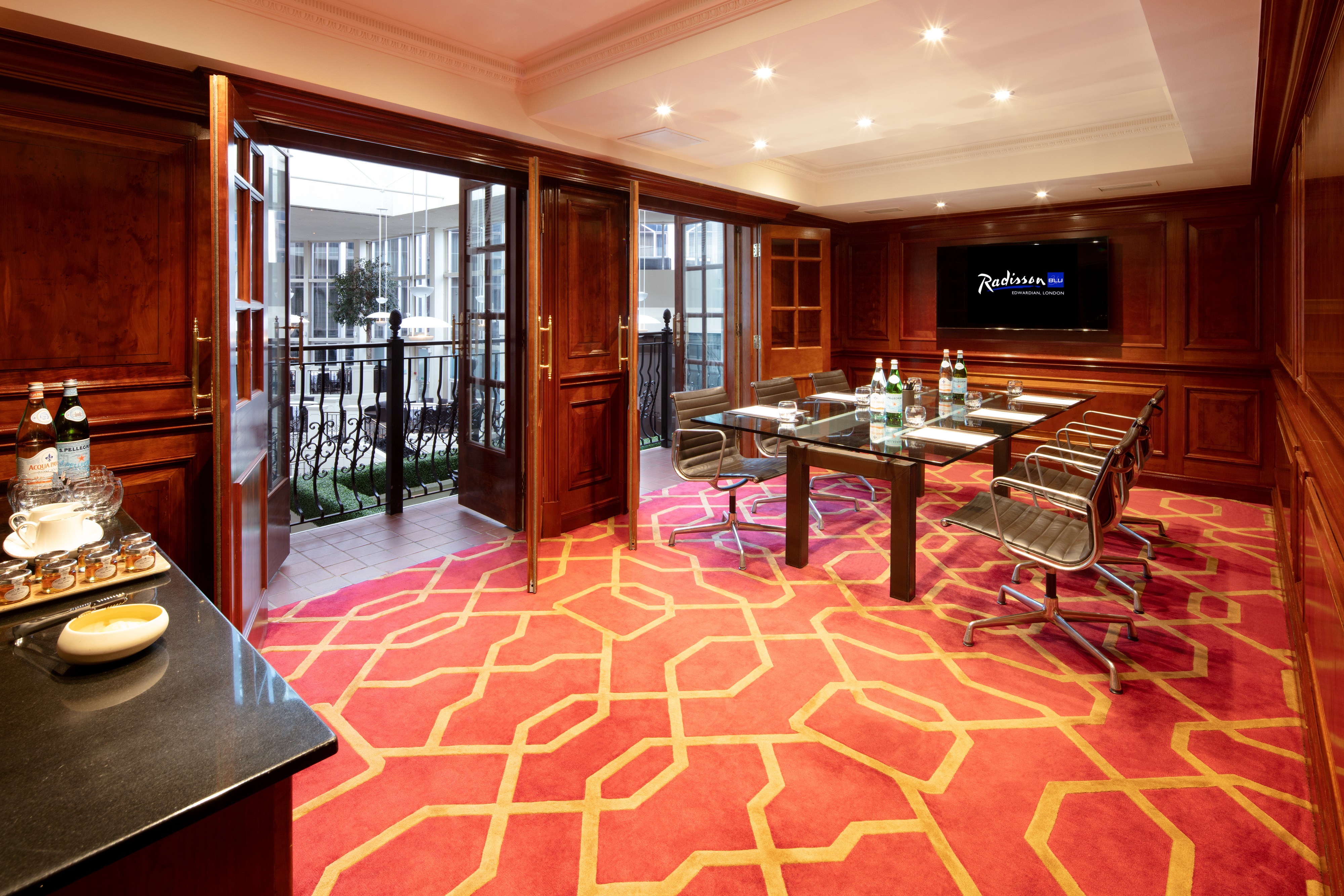 Private Room 30 at Radisson Blu Heathrow, modern meeting space with natural light.