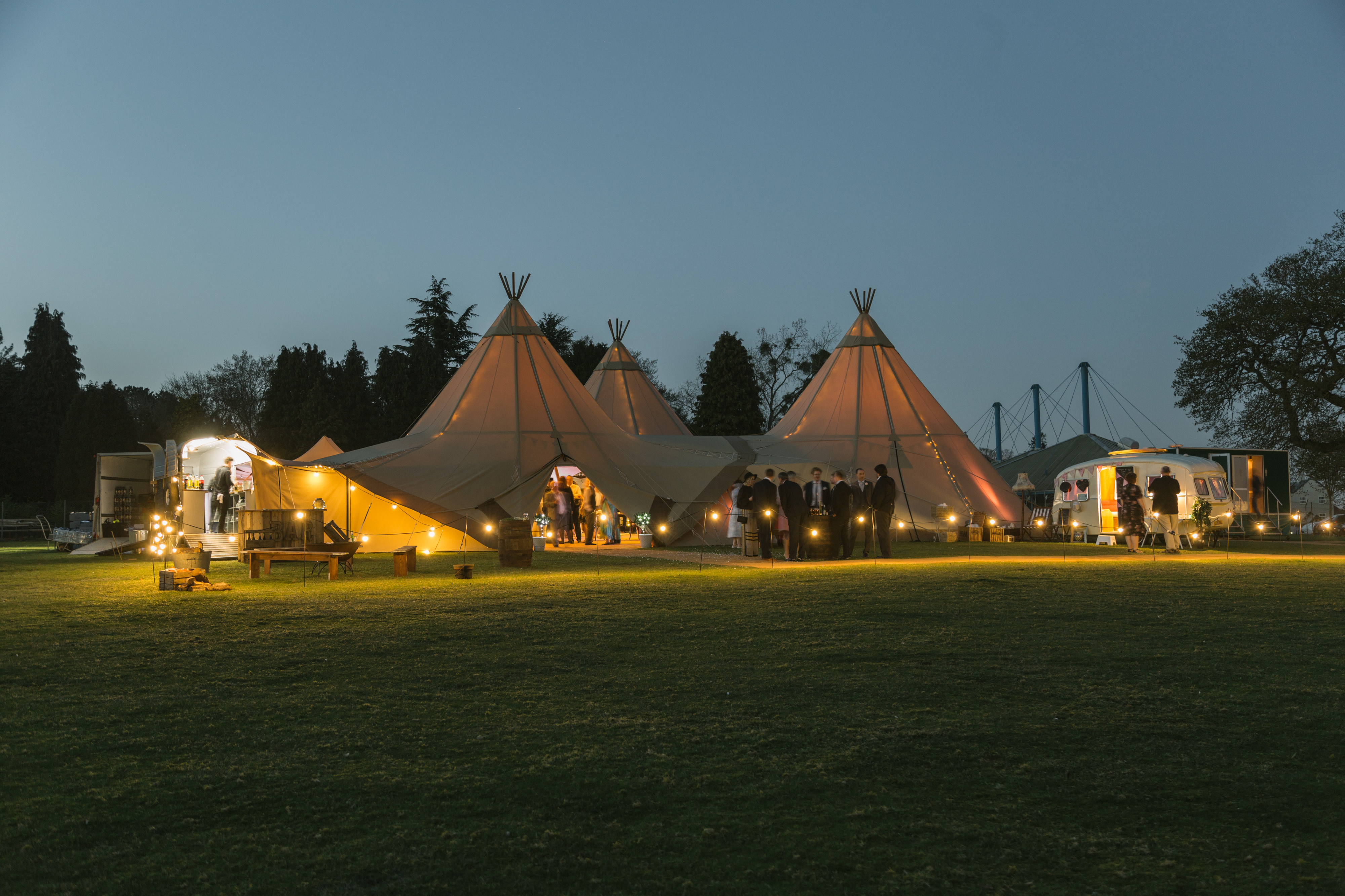 Illuminated tipis in Vanstone Park, ideal for weddings and outdoor events.