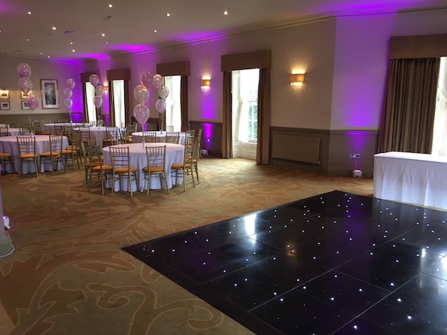 Elegant event space in The Mansion with round tables, perfect for celebrations and corporate events.