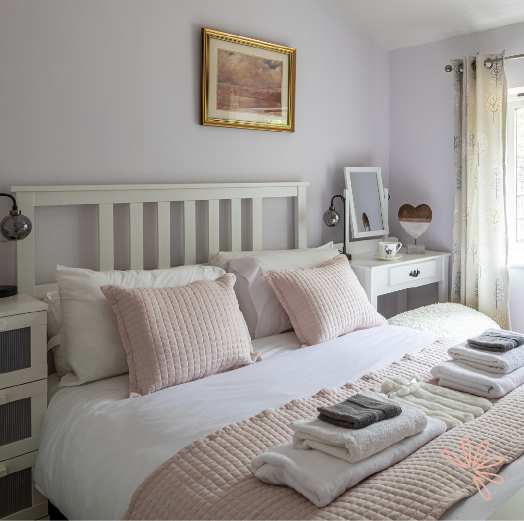 Cozy guest room at Spring Cottage, perfect for event attendees and relaxation.