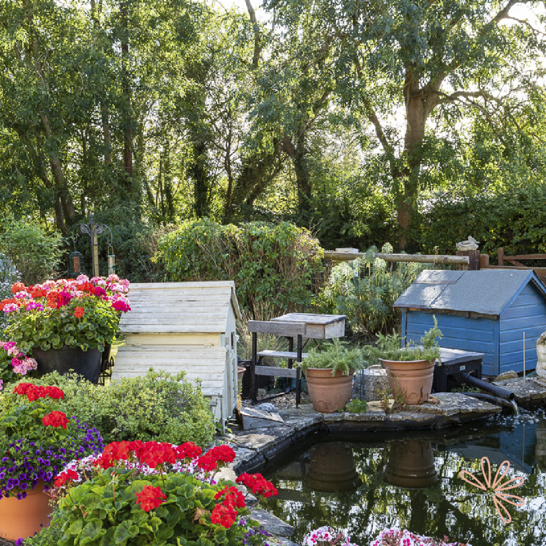 Spring Cottage outdoor venue with vibrant flowers, ideal for gatherings and team-building events.