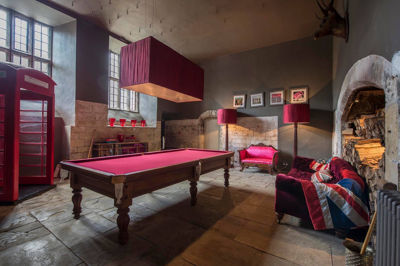 Stylish event space in Howsham Hall with vibrant pool table, ideal for gatherings.
