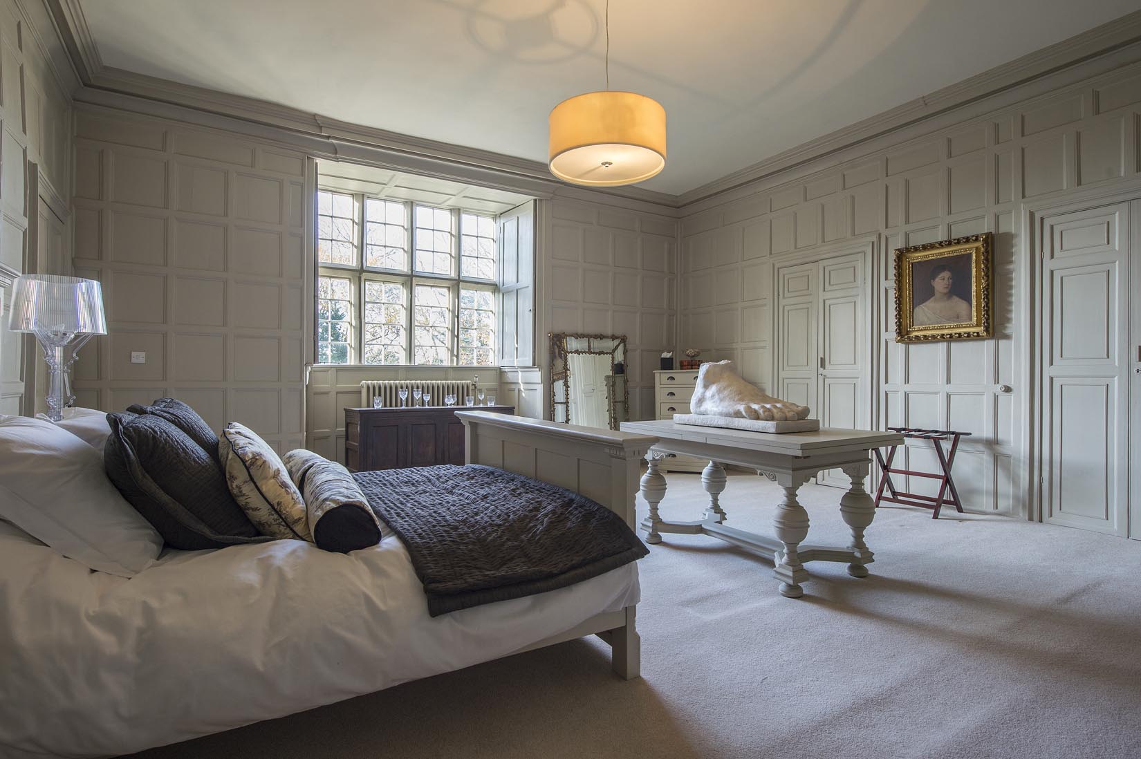 Elegant bedroom in Howsham Hall for meetings and events, featuring classic furnishings.