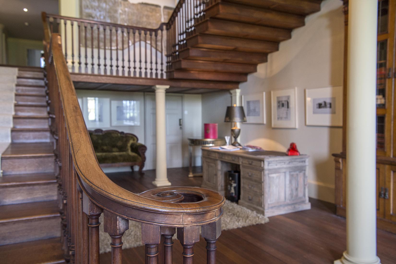 Elegant entryway with grand staircase at Howsham Hall for events and gatherings.