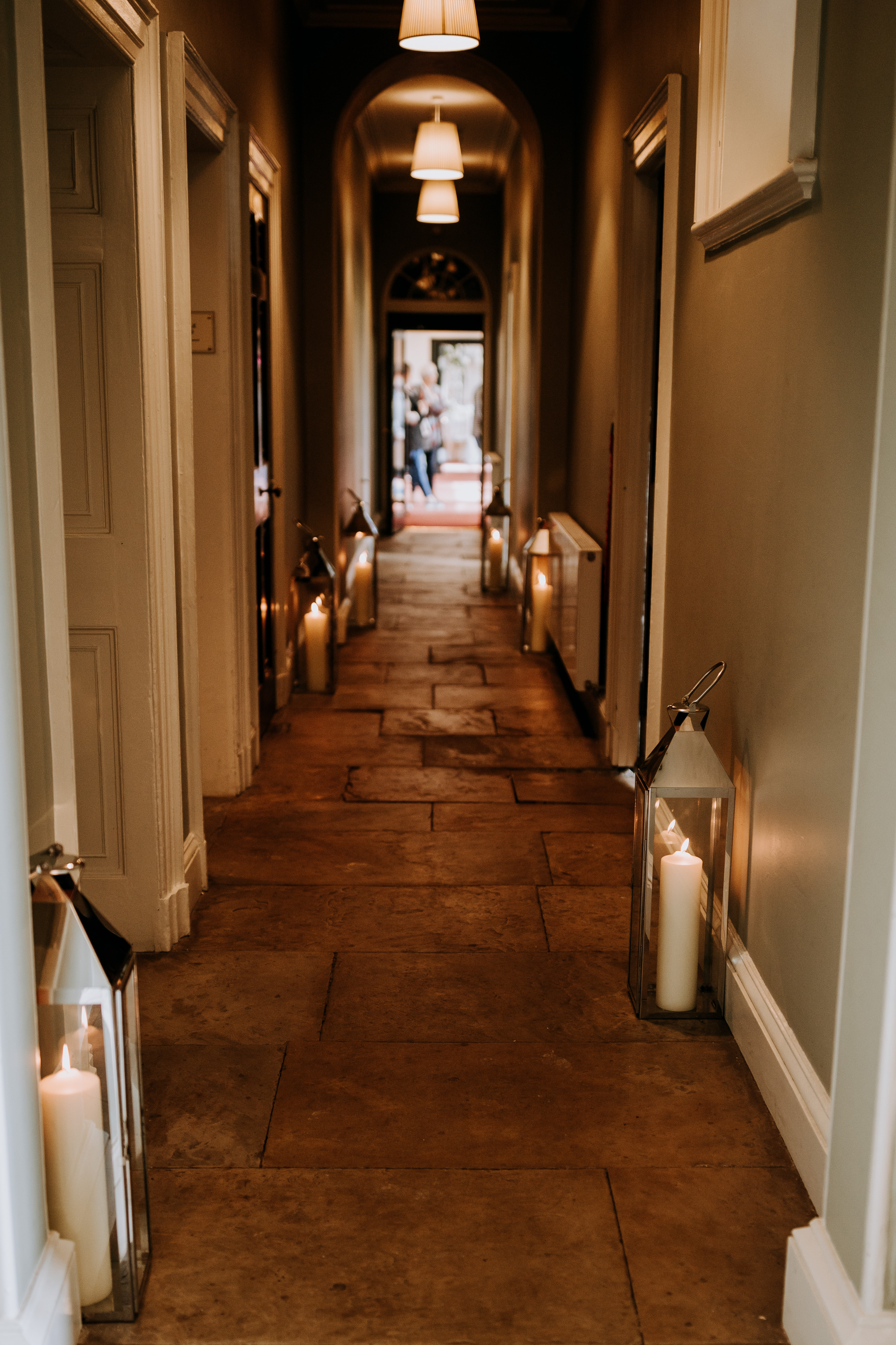 Elegant hallway with lanterns at Rise Hall, ideal for weddings and intimate gatherings.