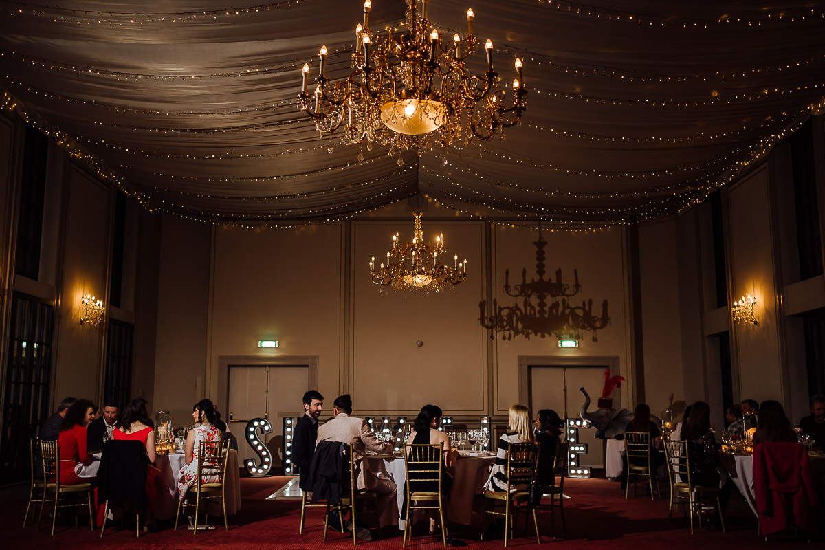 Elegant event space in Rise Hall with draped ceiling and twinkling lights for celebrations.