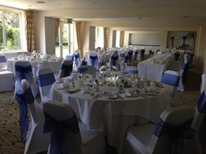 Cambridge Suite banquet room with elegant tables, ideal for weddings and corporate events.