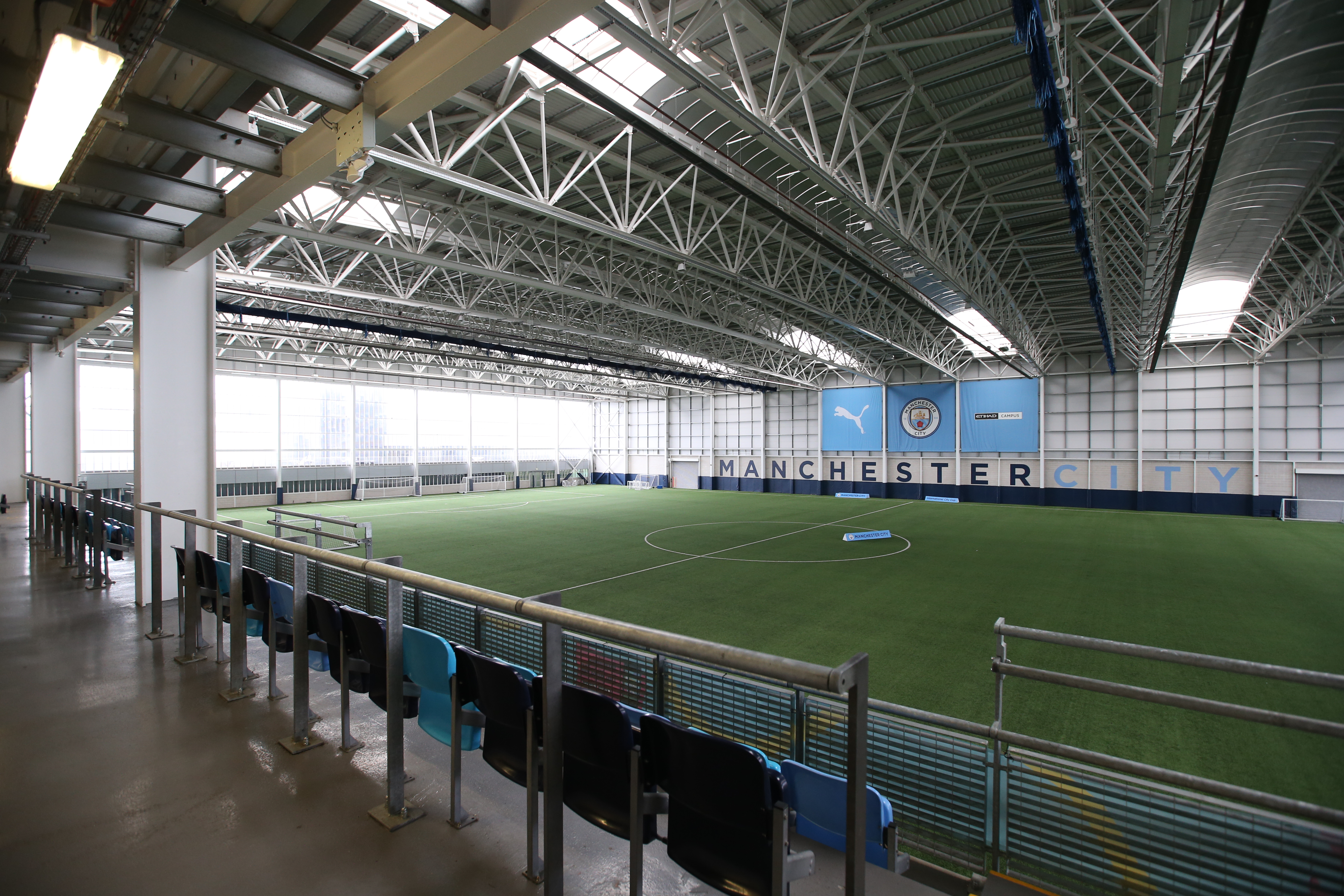 Spacious indoor sports venue at City Football Academy for corporate events and team-building.