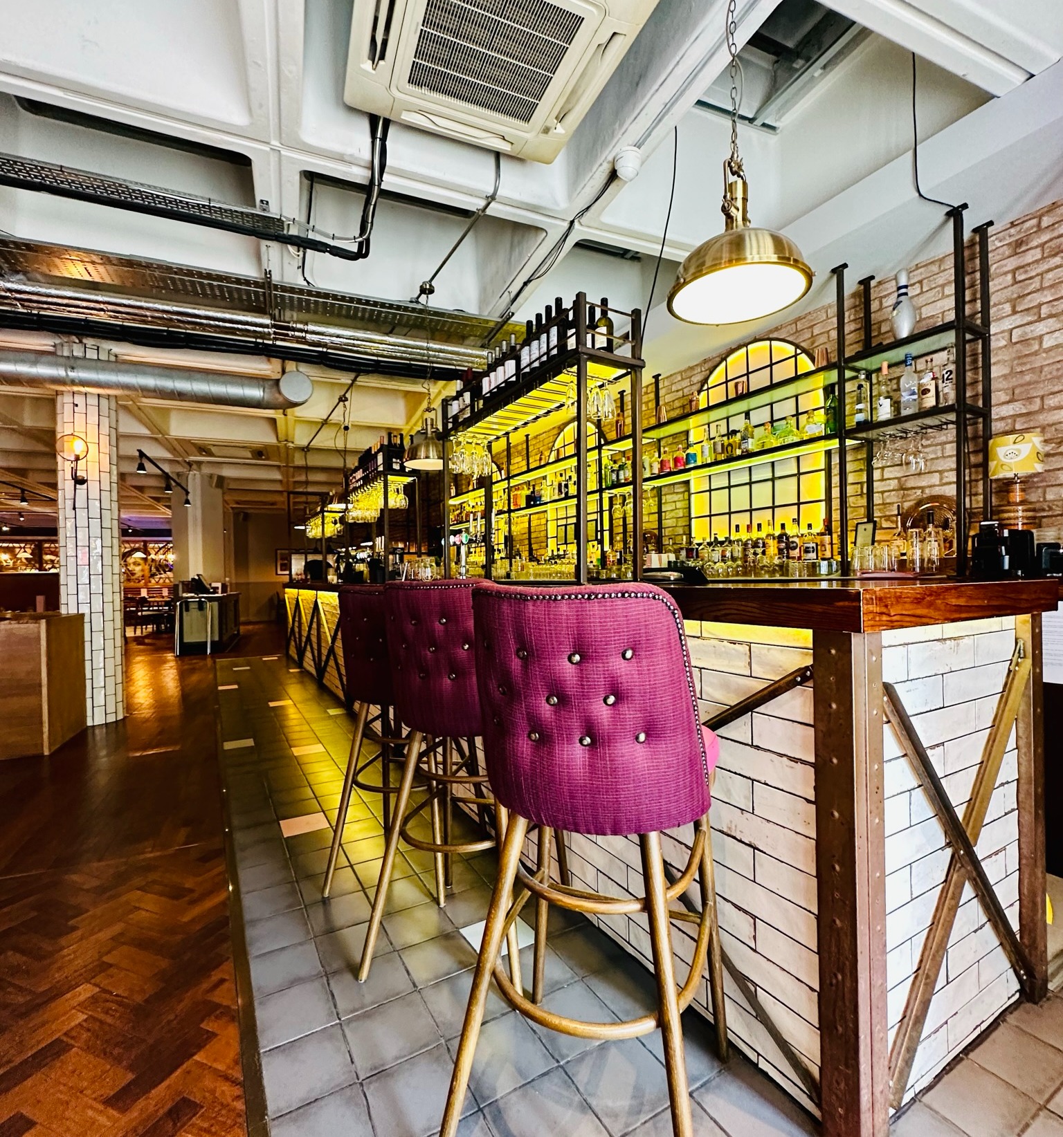 Stylish bar with purple stools in Main Hall Exclusive, perfect for networking events.