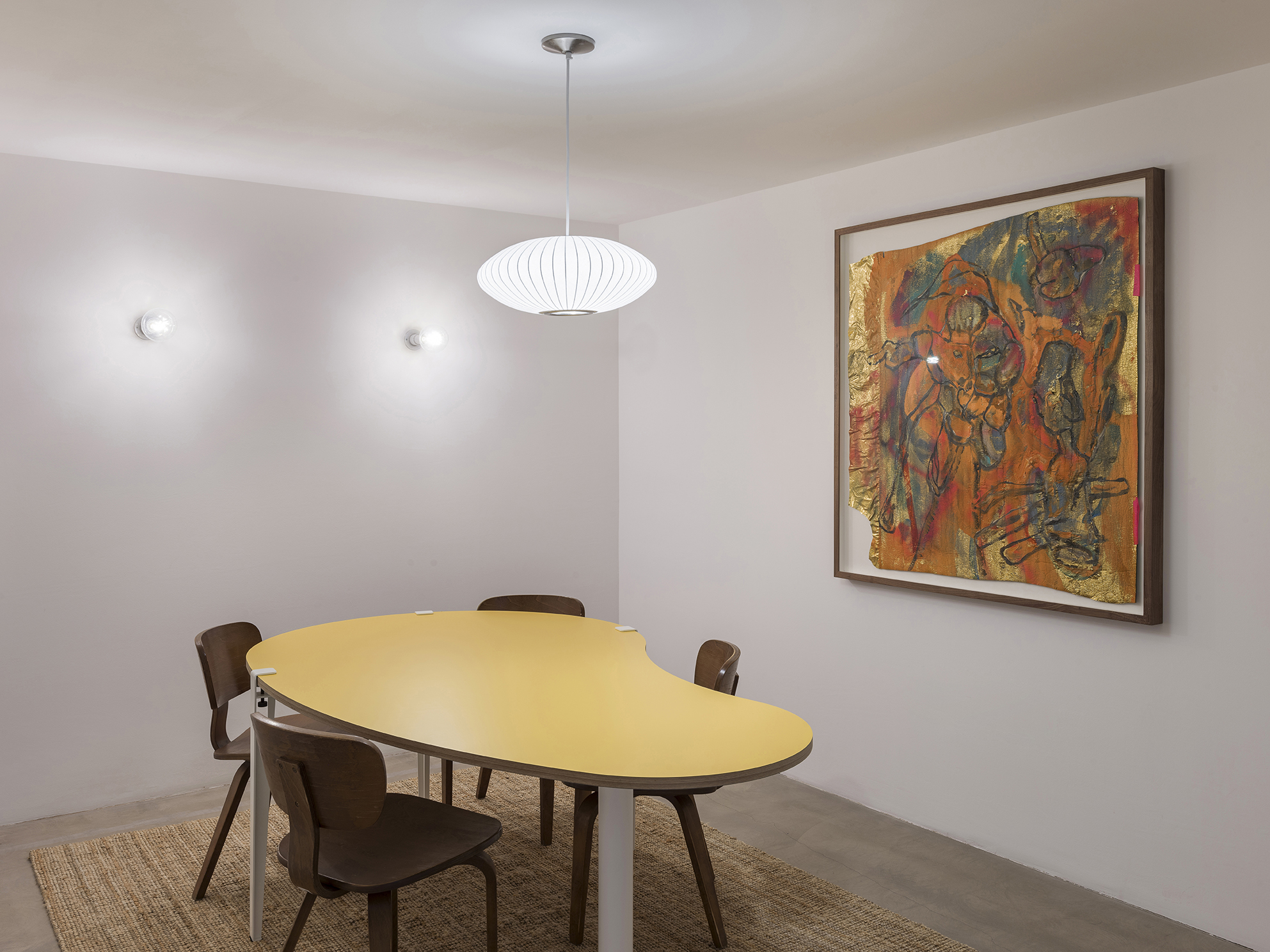 Modern meeting space with yellow table for collaborative events at Arc Club.