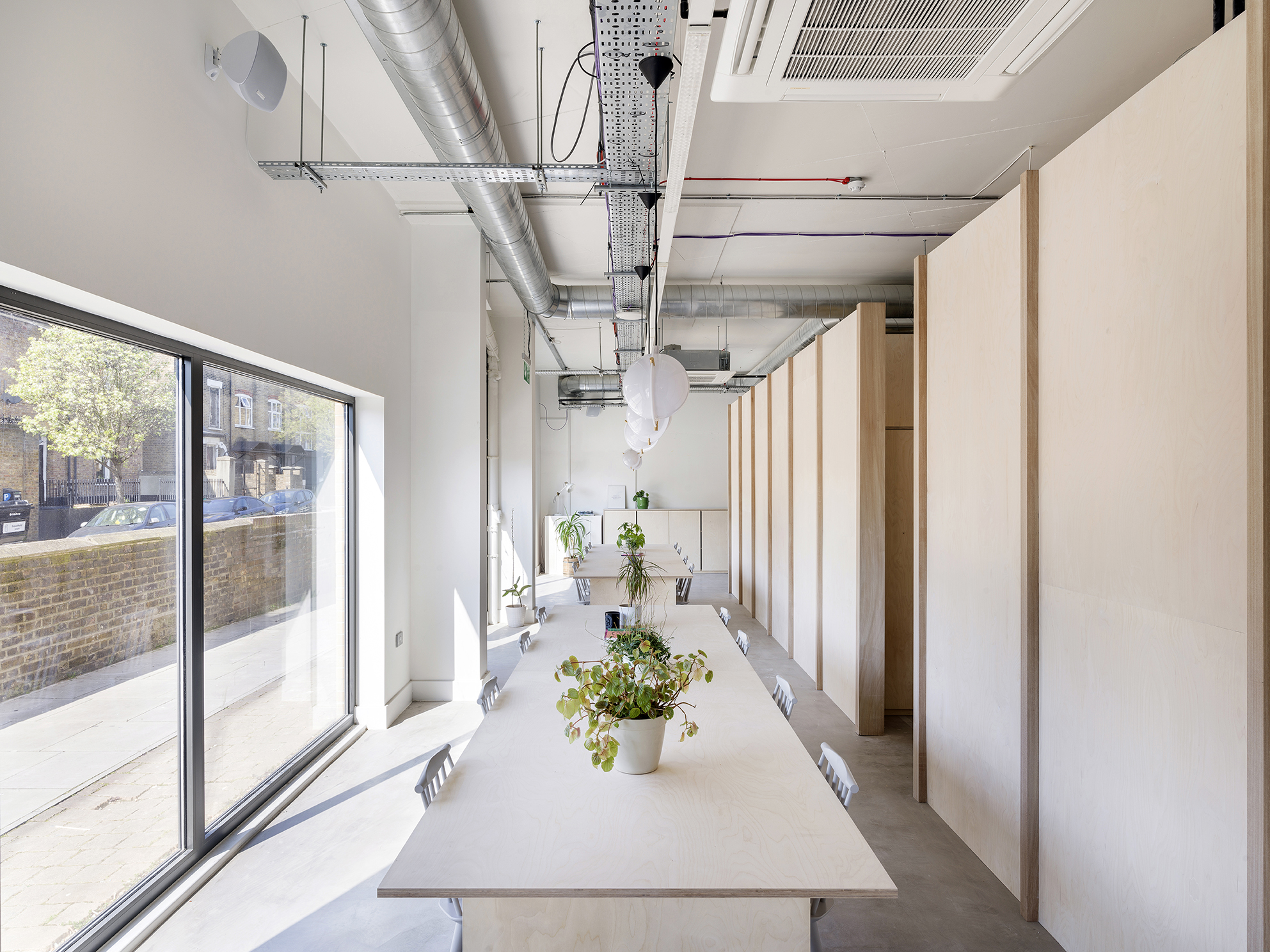 Modern meeting space with large windows for full venue hire at Arc Club.