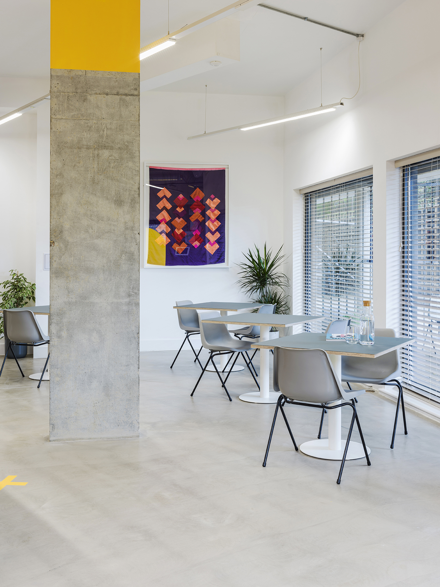 Modern meeting space in Arc Club, ideal for workshops and gatherings with vibrant decor.