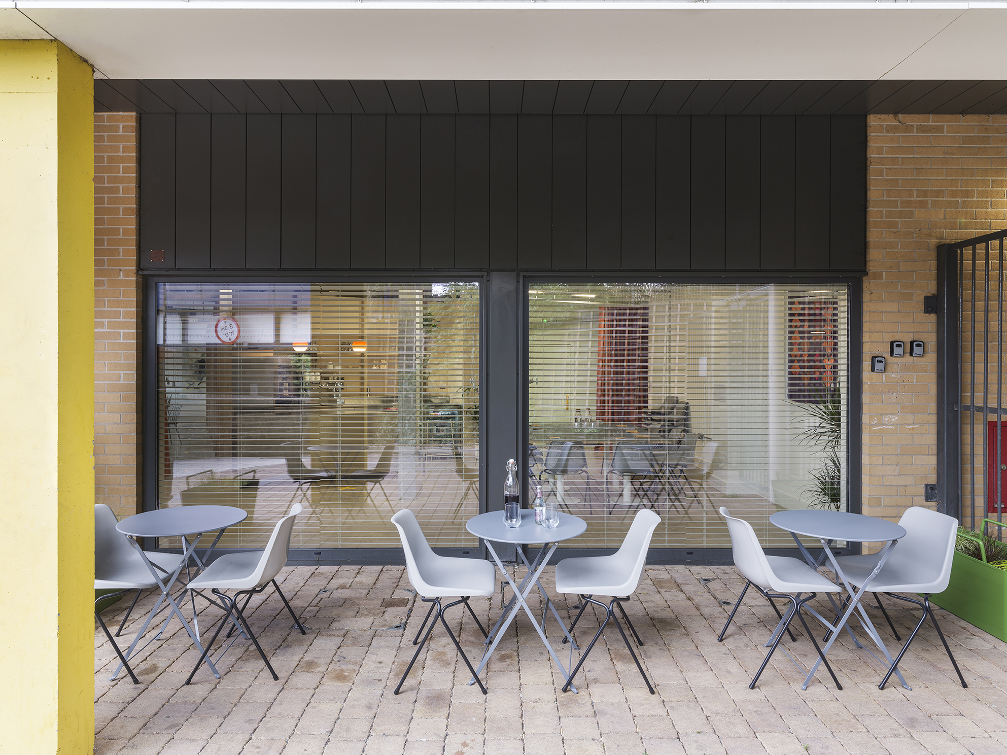 Modern outdoor seating at Arc Club for casual meetings and networking events.