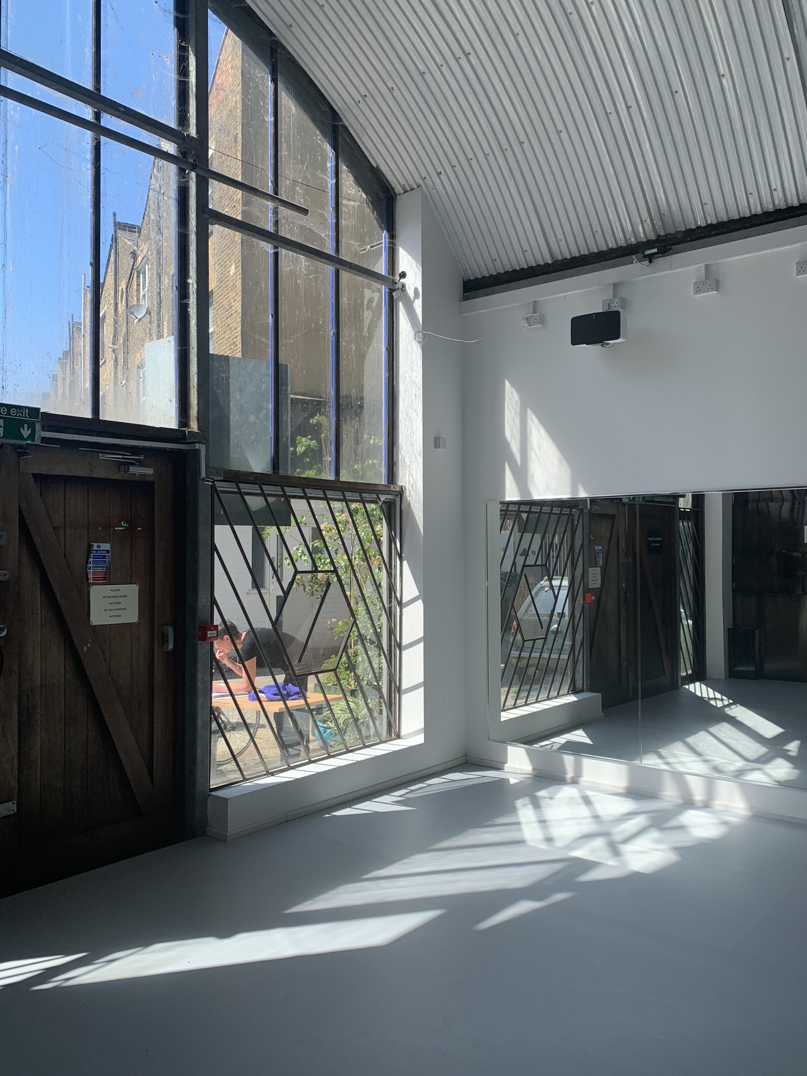 Bright modern event space with large windows, perfect for meetings and workshops.