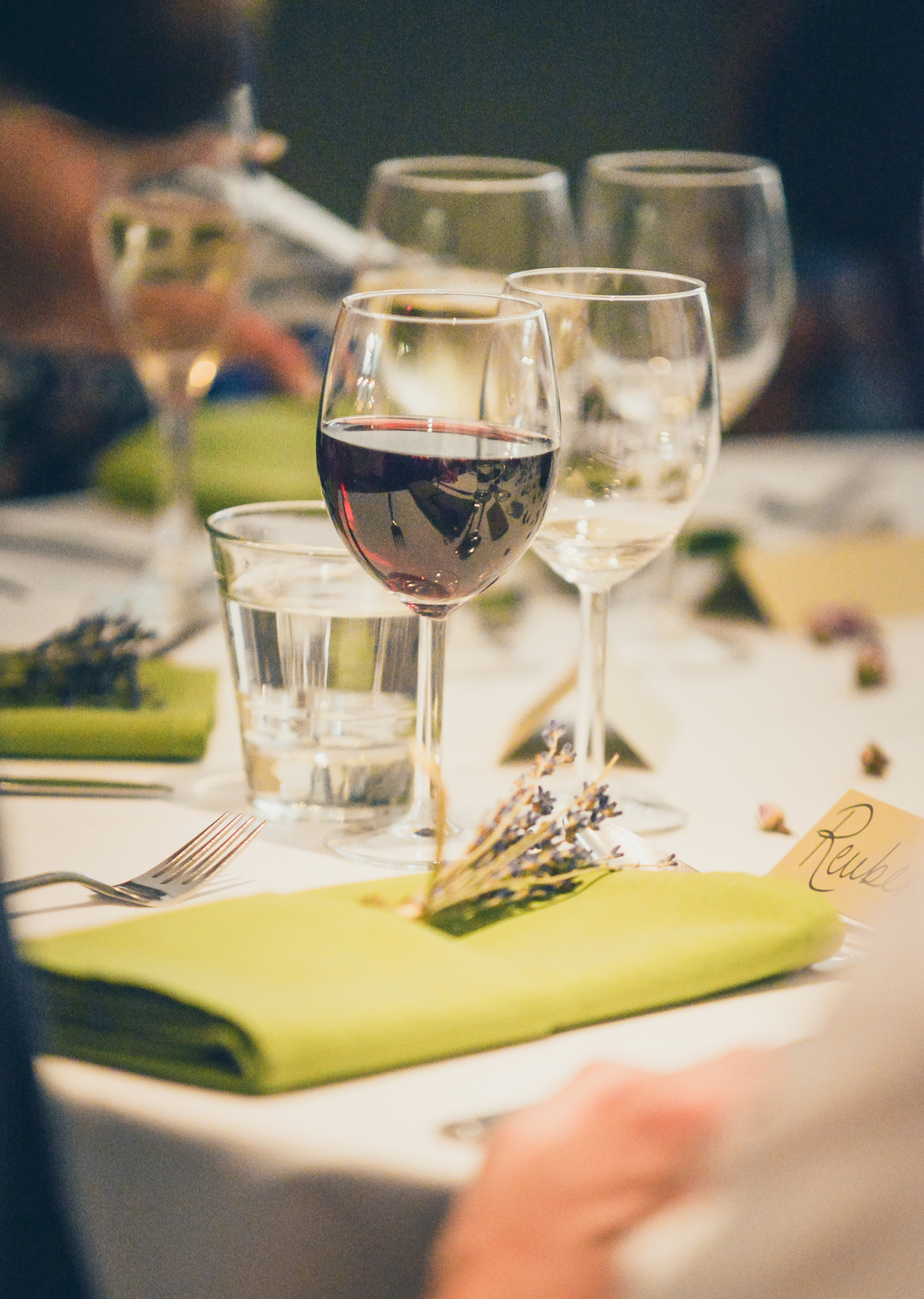 Yurt Cafe dining table with red wine, perfect for elegant events and meetings.
