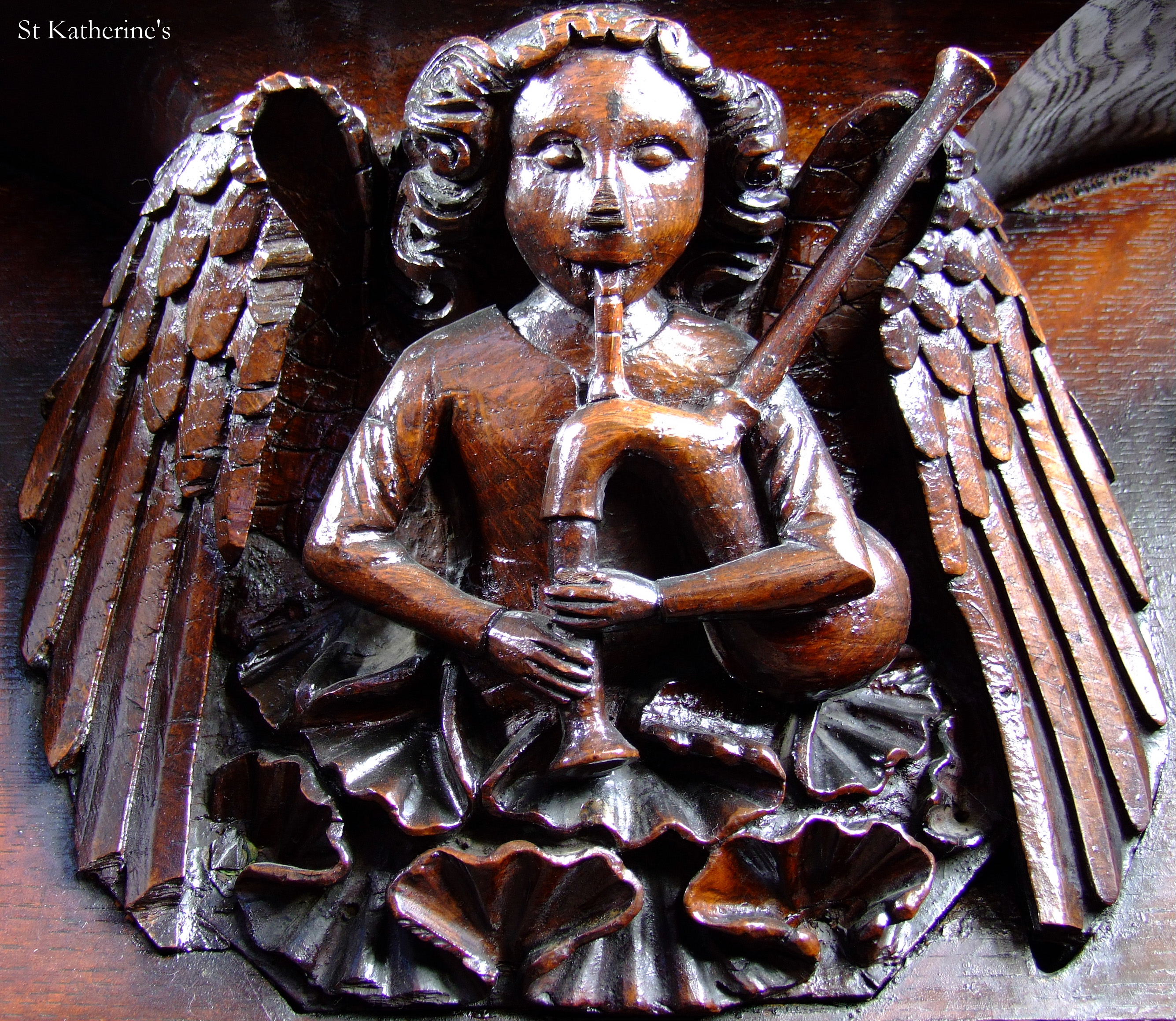 Angel bagpiper statue in Royal Foundation of St. Katharine event space decor.