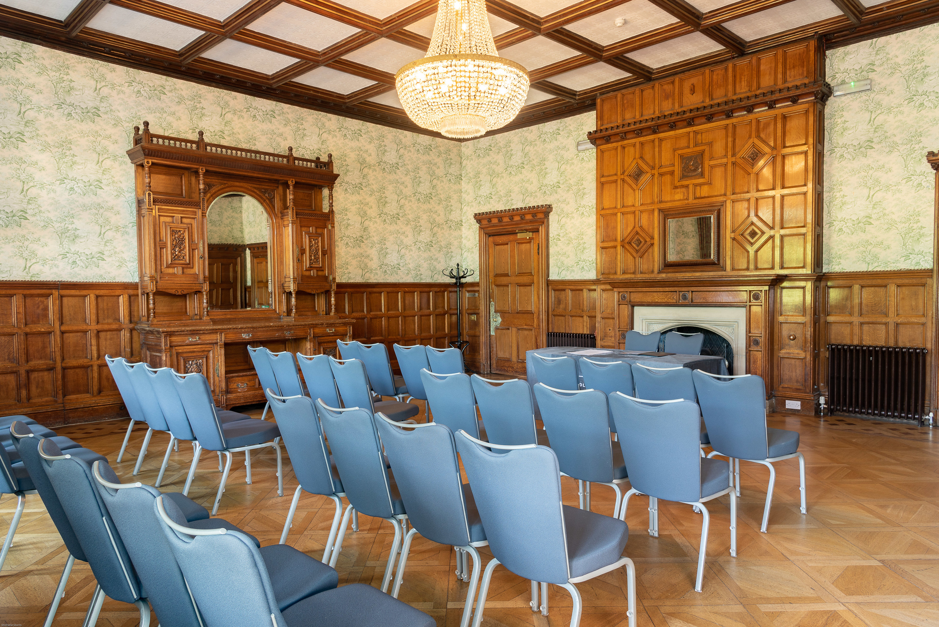 Elegant Charles Suite meeting room with wooden paneling, ideal for corporate events.