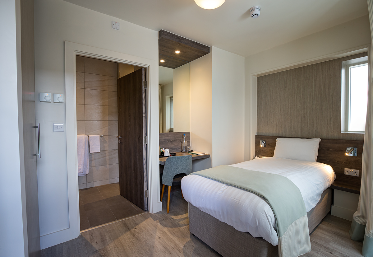 St John Groser room: minimalist hotel room for business events with en-suite bathroom.