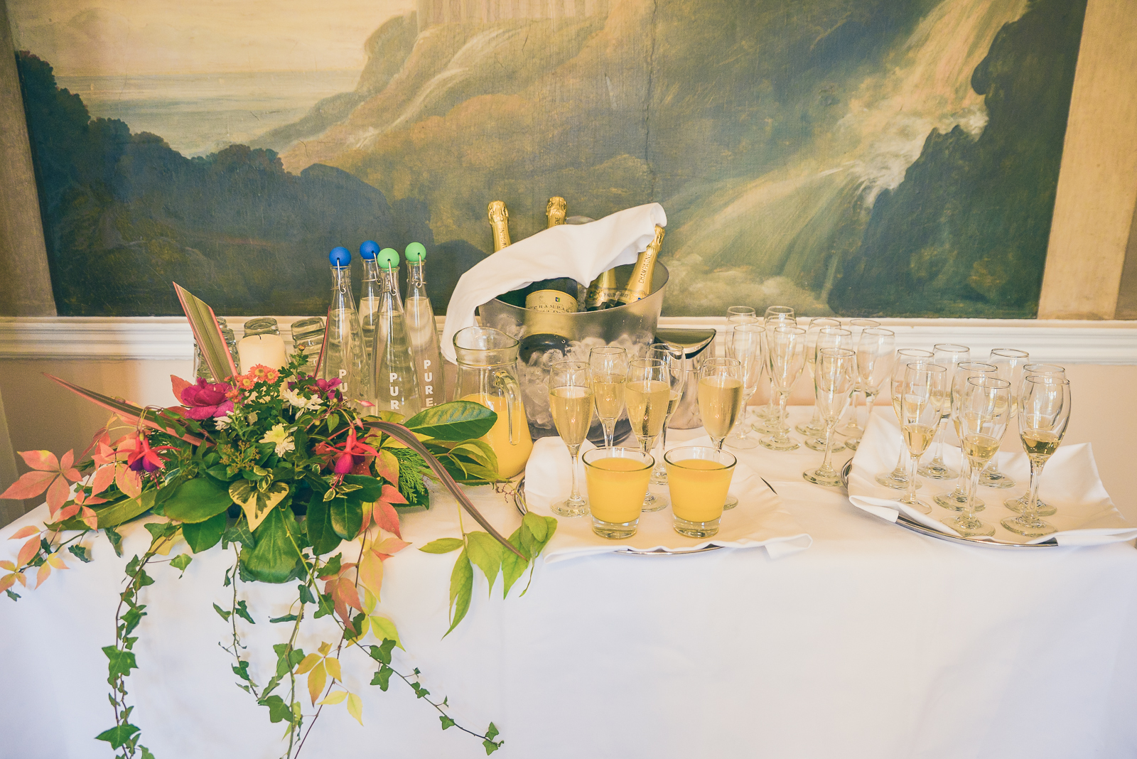 Elegant beverage station with champagne and flowers for events at St John Groser room.