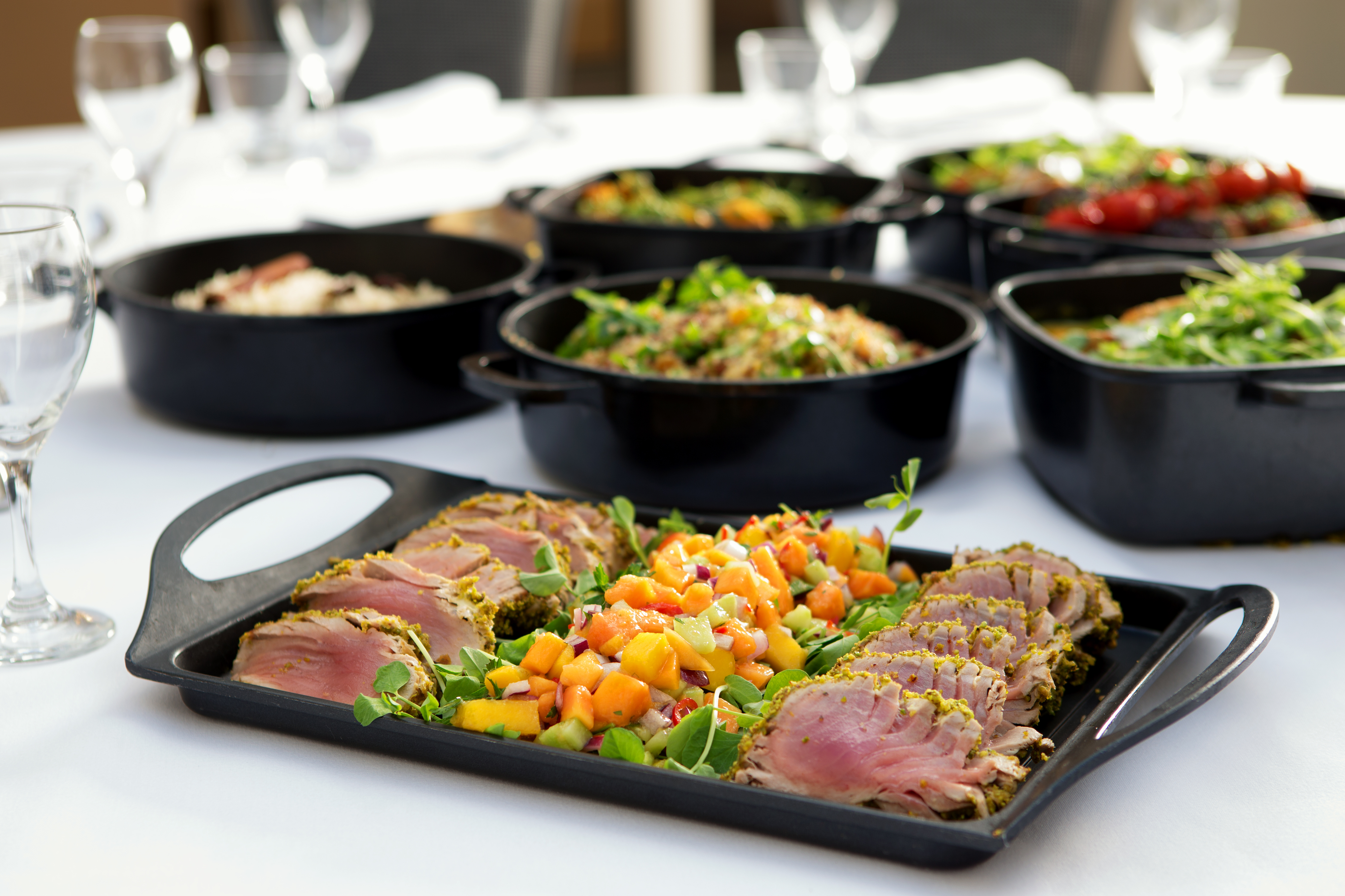 St John Groser room buffet with herb-crusted meat, ideal for upscale events.