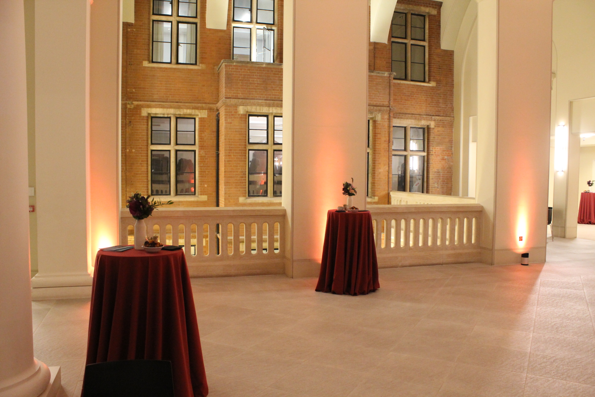 Elegant event space at Royal College of Music with burgundy linens for receptions.