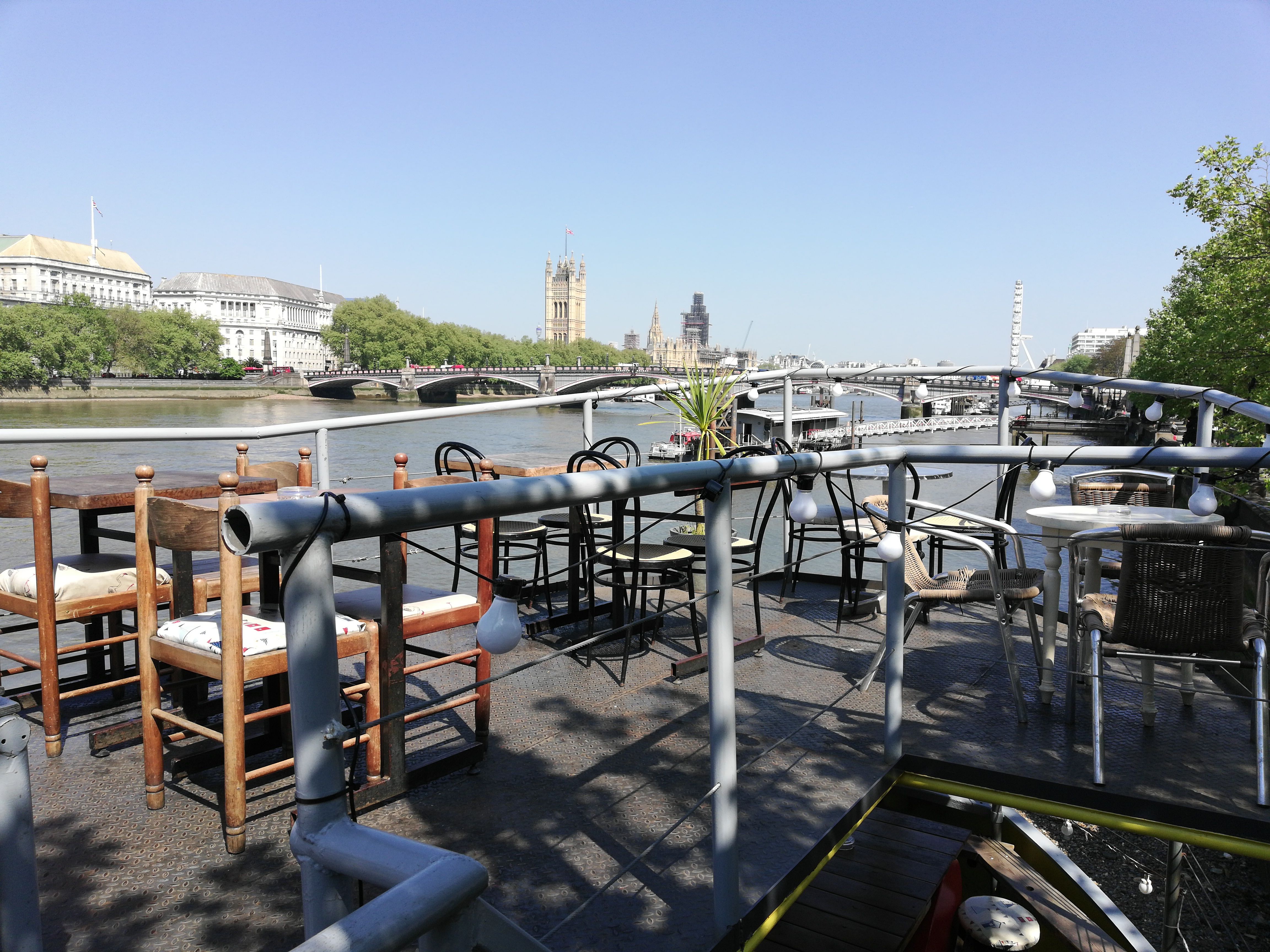Outdoor event venue at Tamesis Dock with scenic river views and relaxed seating.