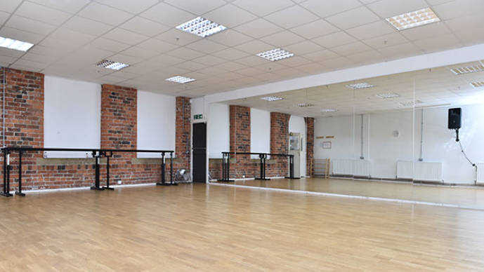 Dance Studio 3 with polished wooden floor, ideal for dance classes and workshops.