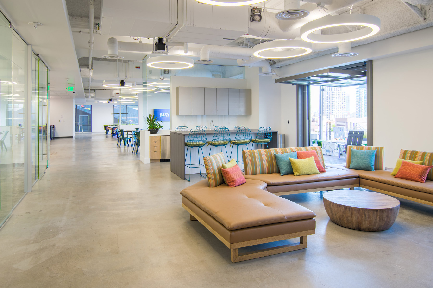 Modern lounge area with vibrant cushions for networking events and informal meetings.