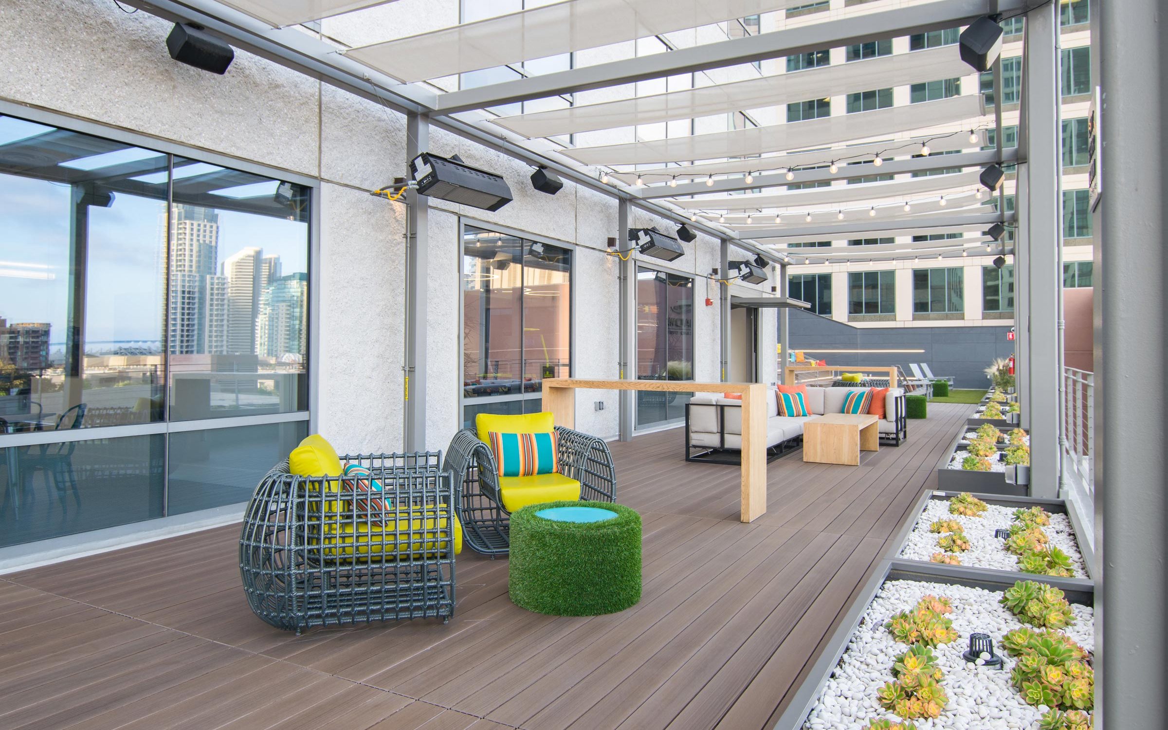 Modern rooftop event space with stylish seating, perfect for networking and gatherings.