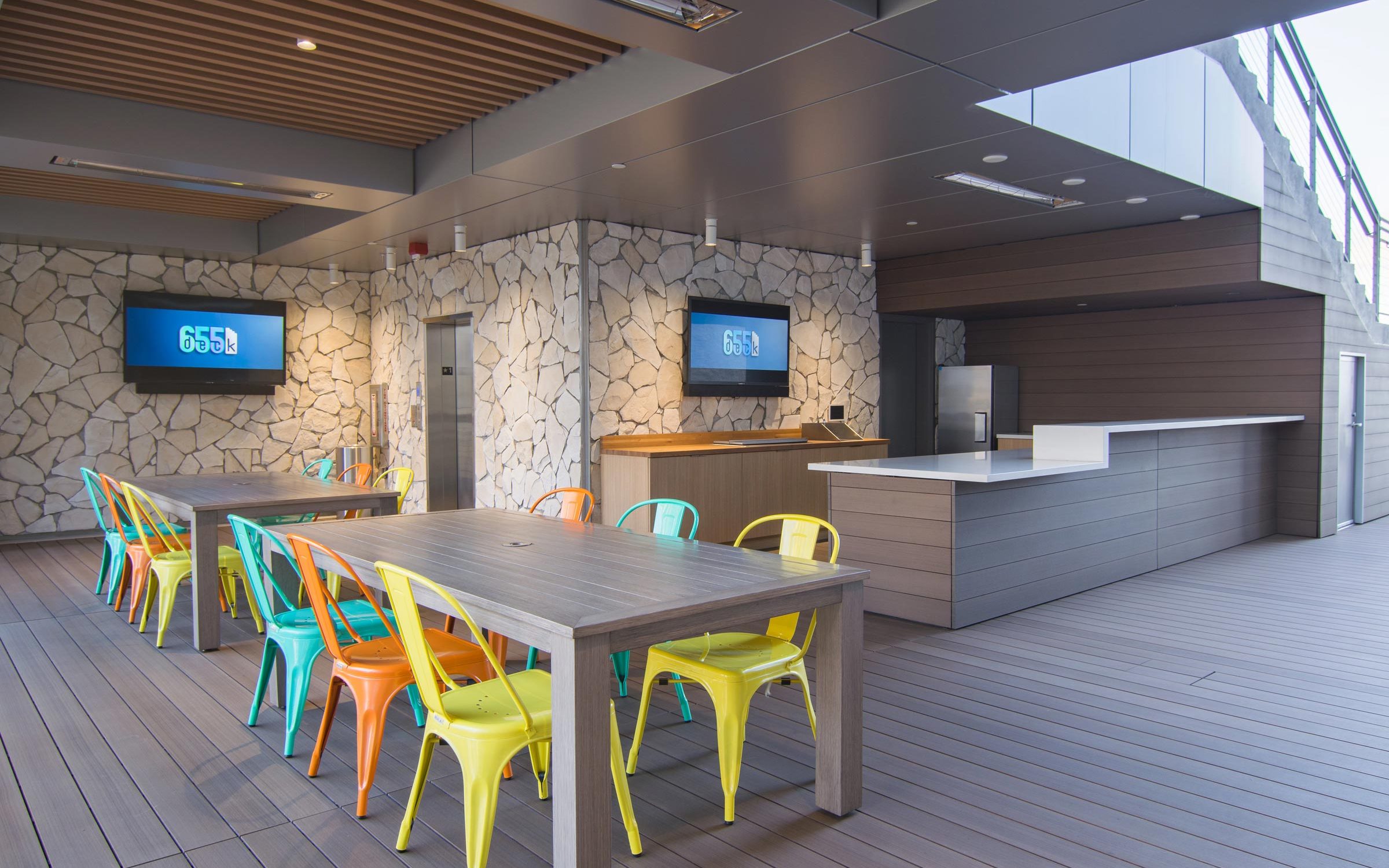Modern event space Deck 655 with colorful seating for networking and gatherings.