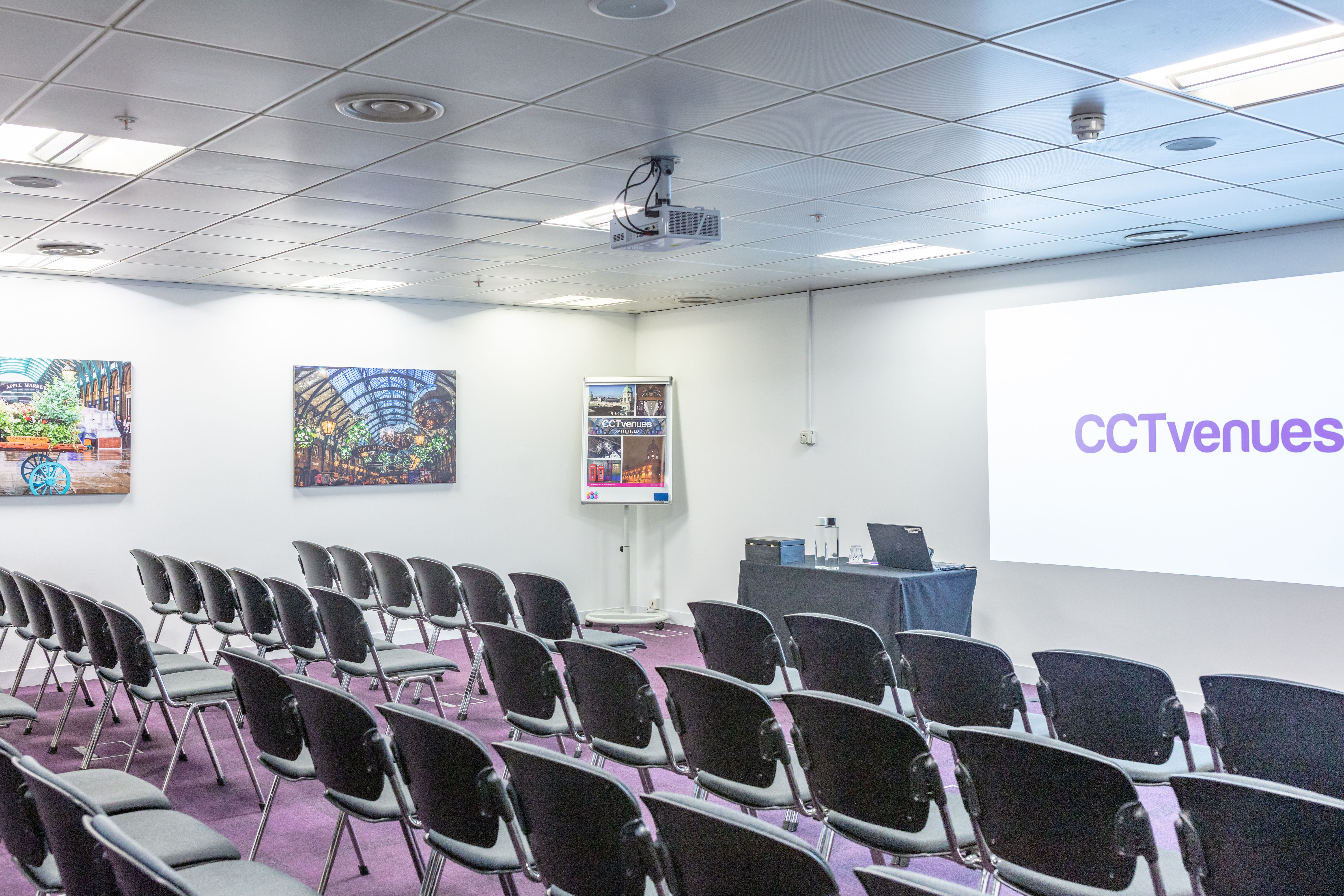 Covent Garden meeting room with projector screen, perfect for corporate events and training.