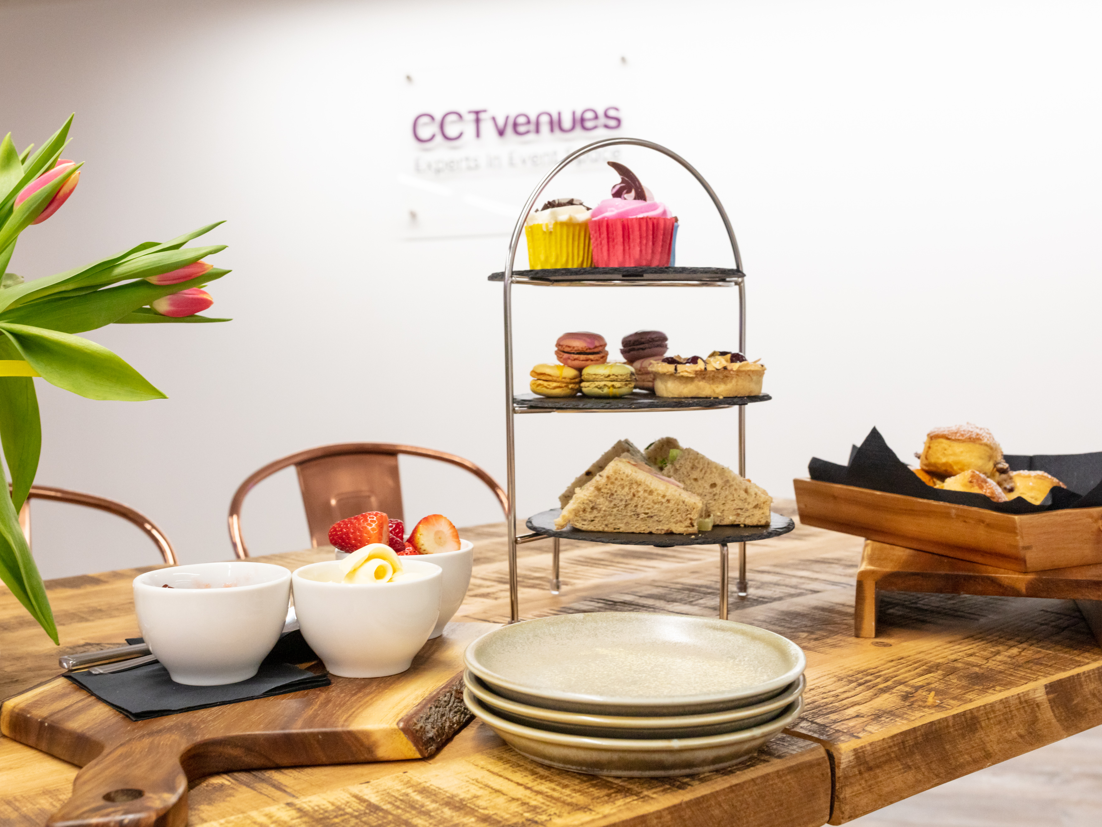 "Refreshment station with pastries at Covent Garden event venue, ideal for meetings."