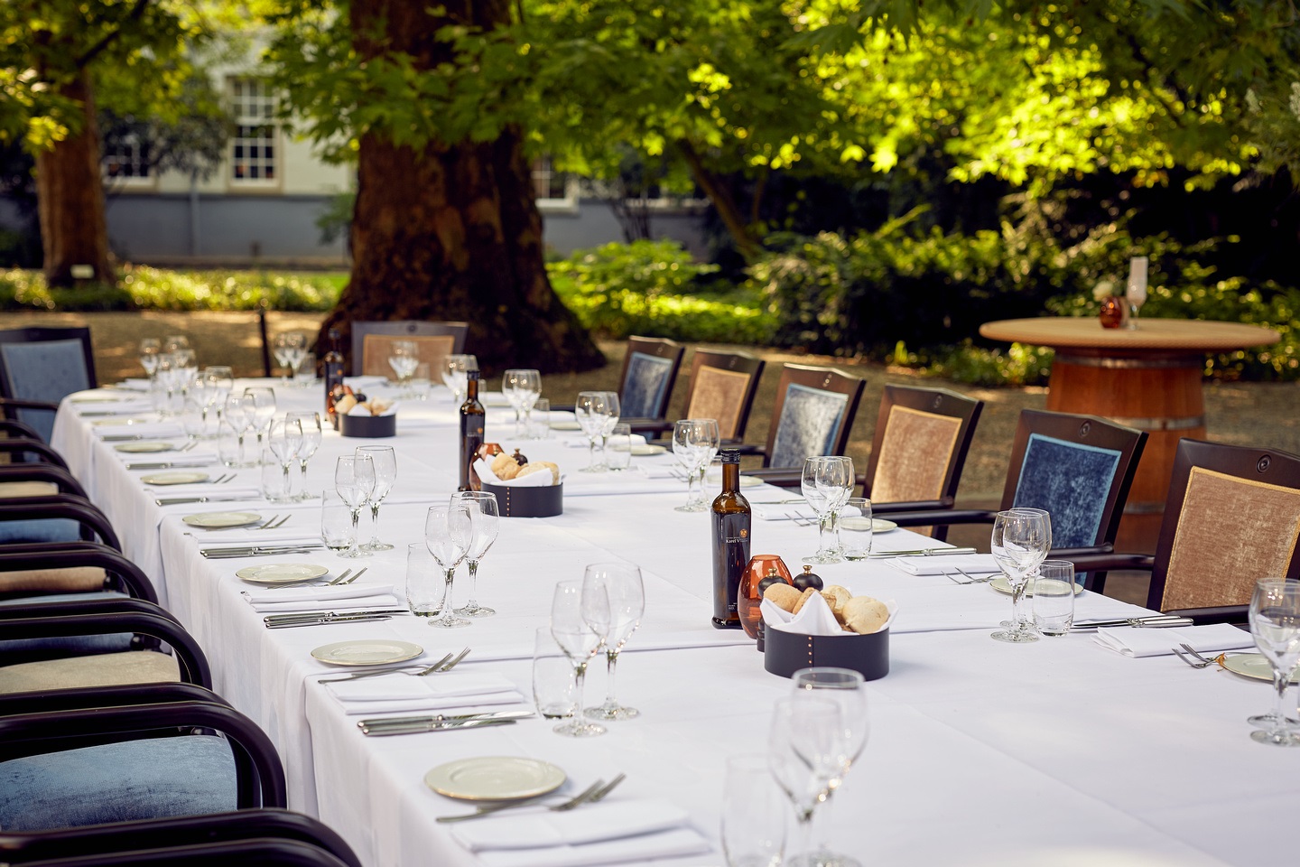 Elegant outdoor dining setup at Grand Hotel Karel V for summer events and corporate retreats.
