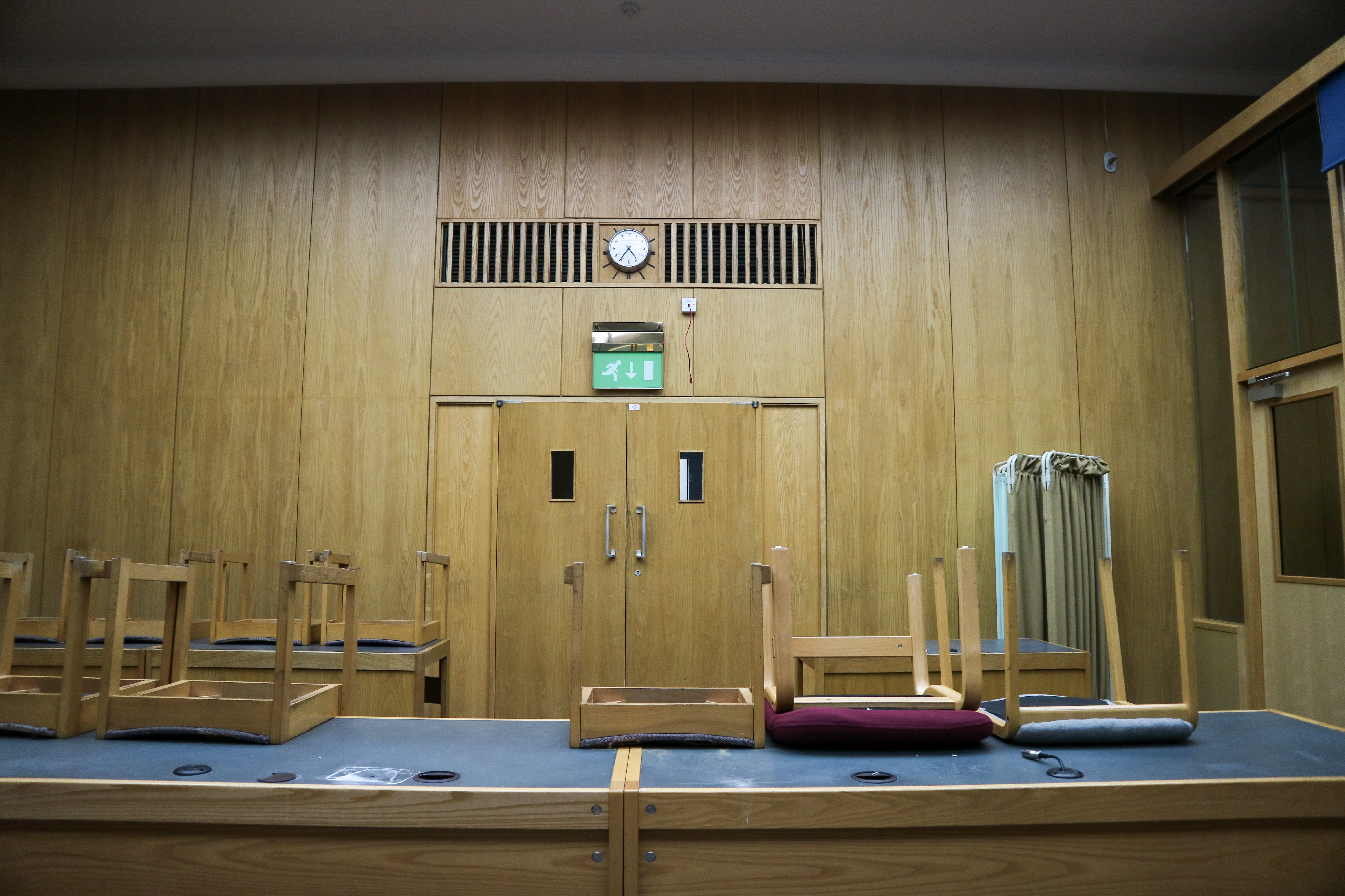 Camberwell Green Magistrate's court meeting space, wooden paneling, event preparation.