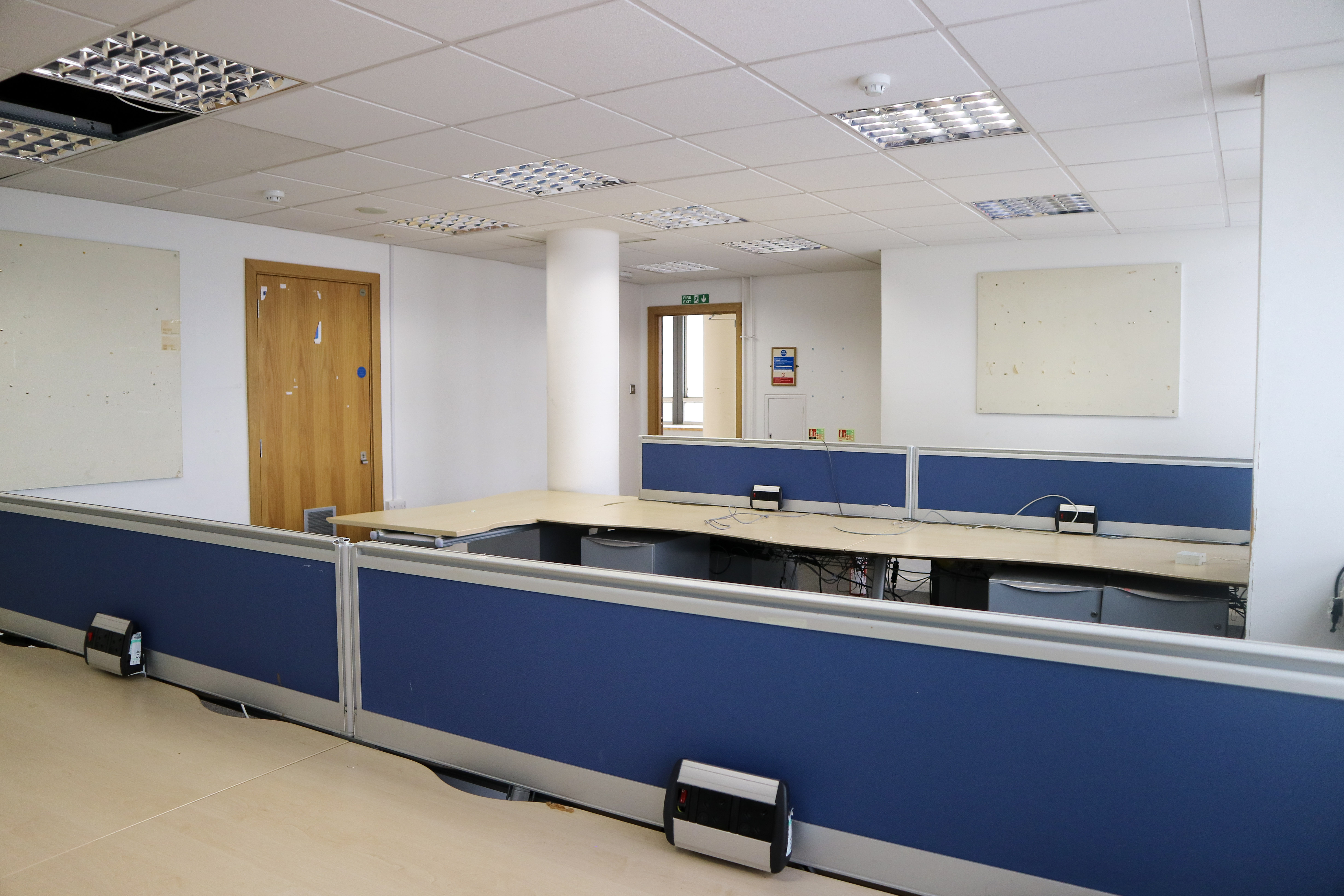 Modern meeting space with large table at Camberwell Green Magistrate's court for events.