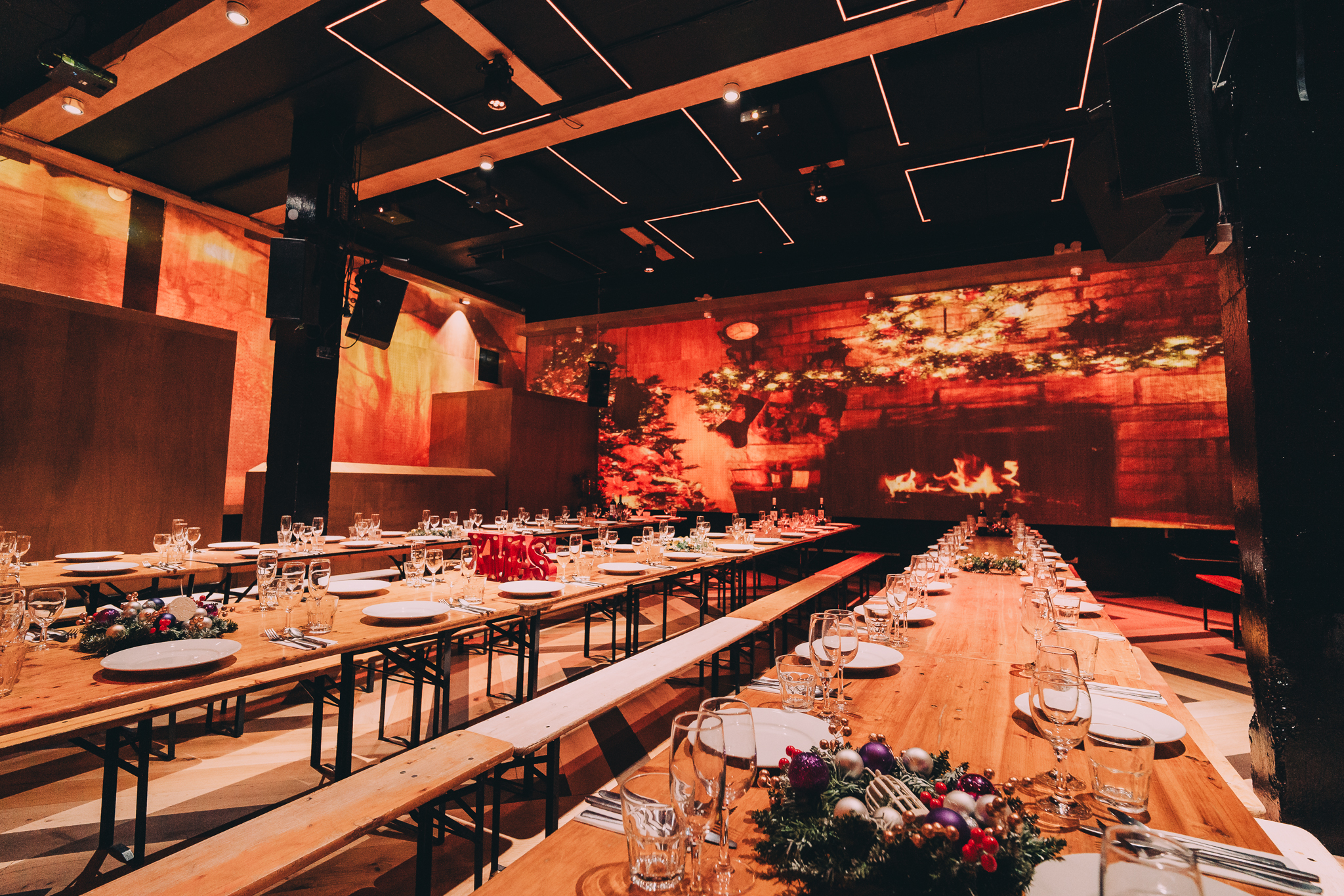Christmas event space at No90 Hackney Wick with elegant table settings and warm lighting.