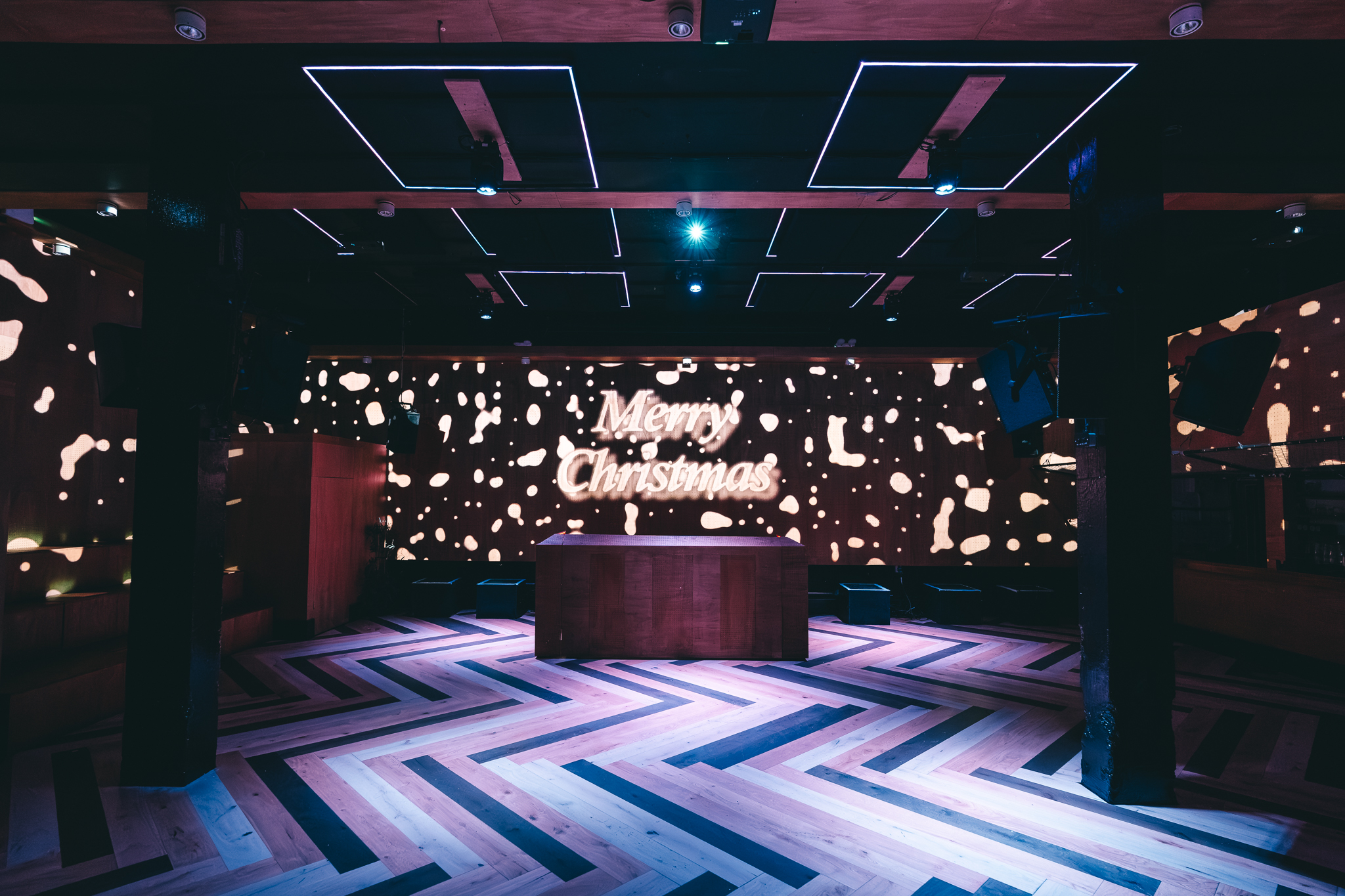 Christmas event space at No90 Hackney Wick with vibrant lighting and festive decor.