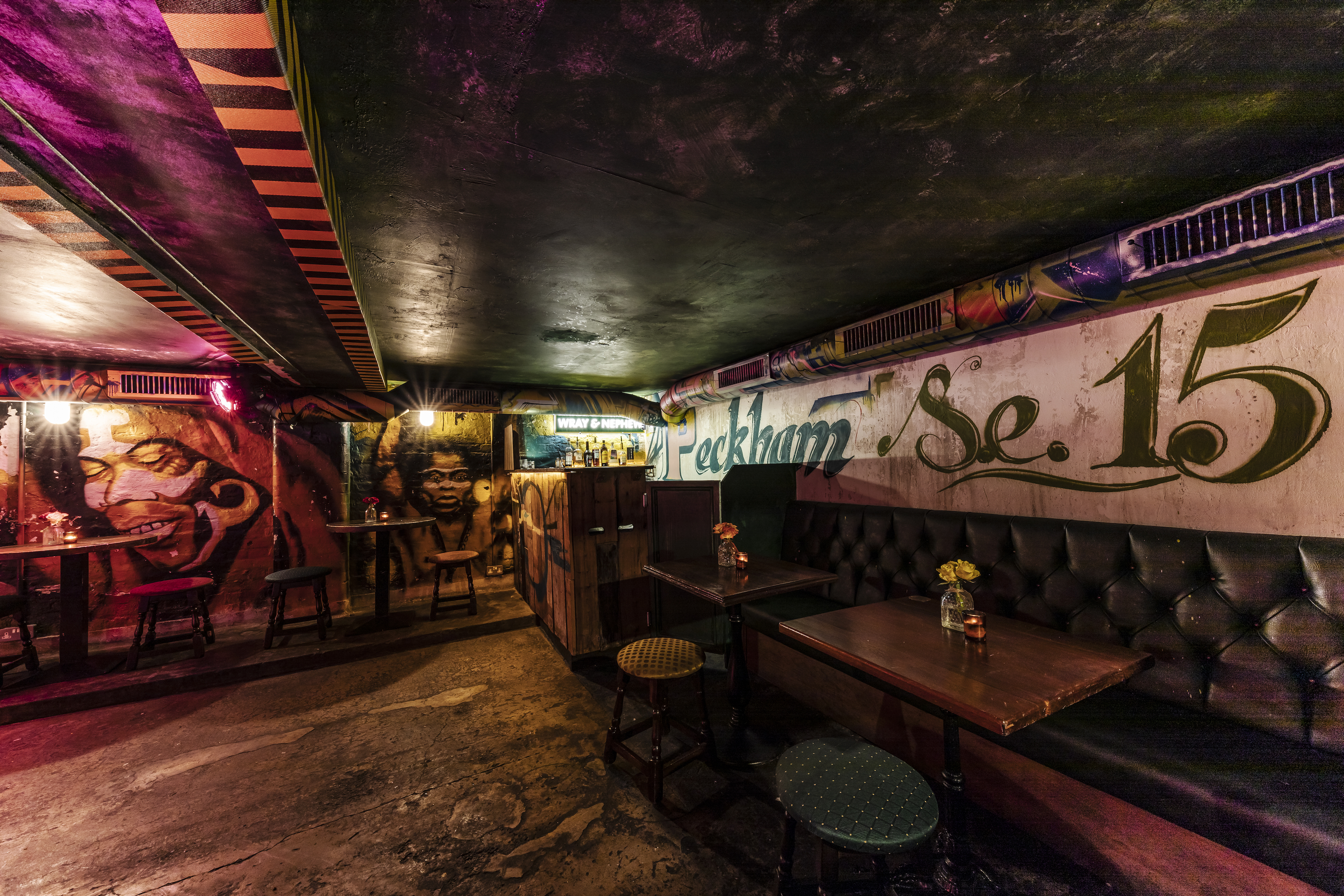 Vibrant venue with colorful murals for intimate gatherings and creative events in Peckham.