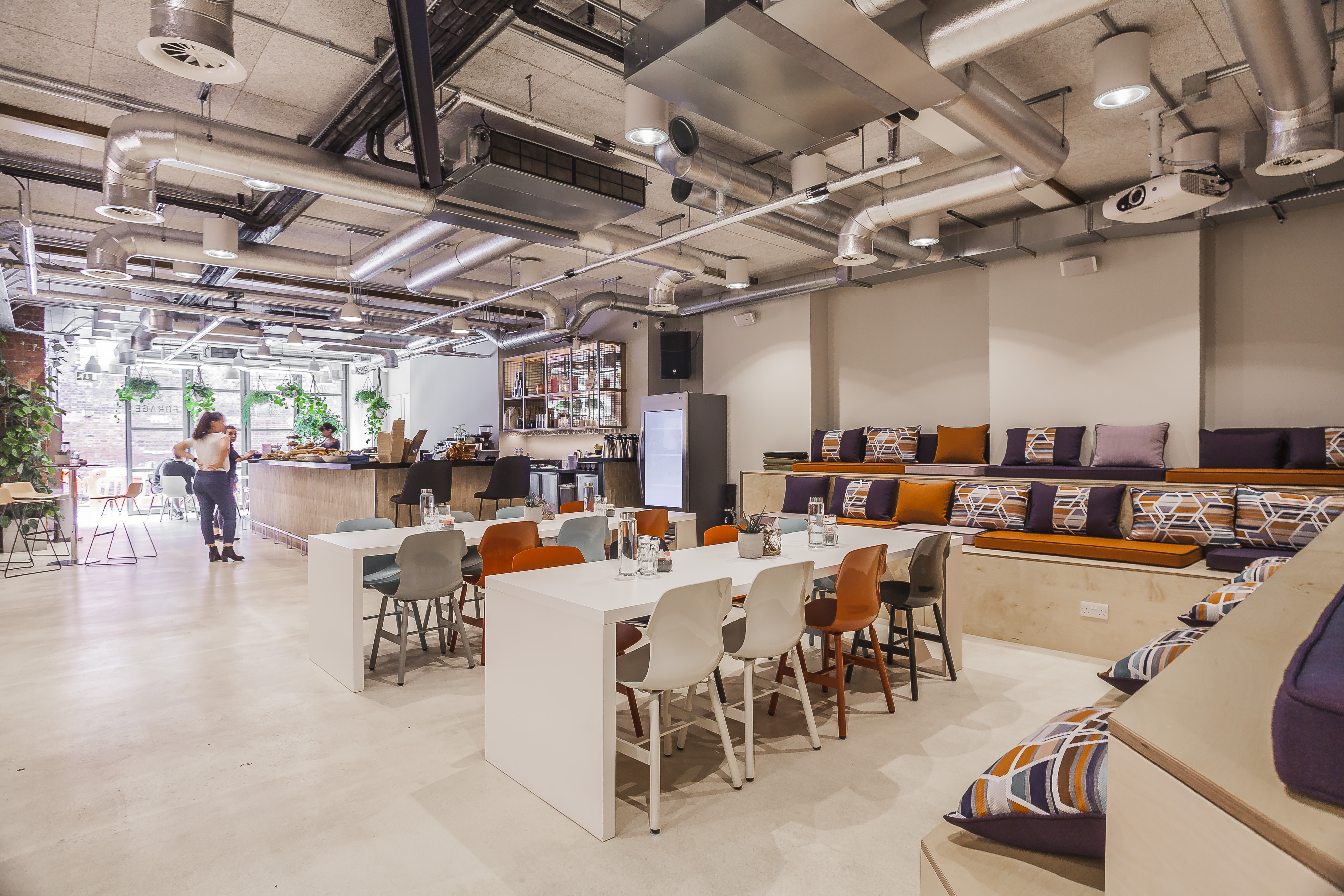 Modern breakout space at The Forum with stadium seating for workshops and networking events.