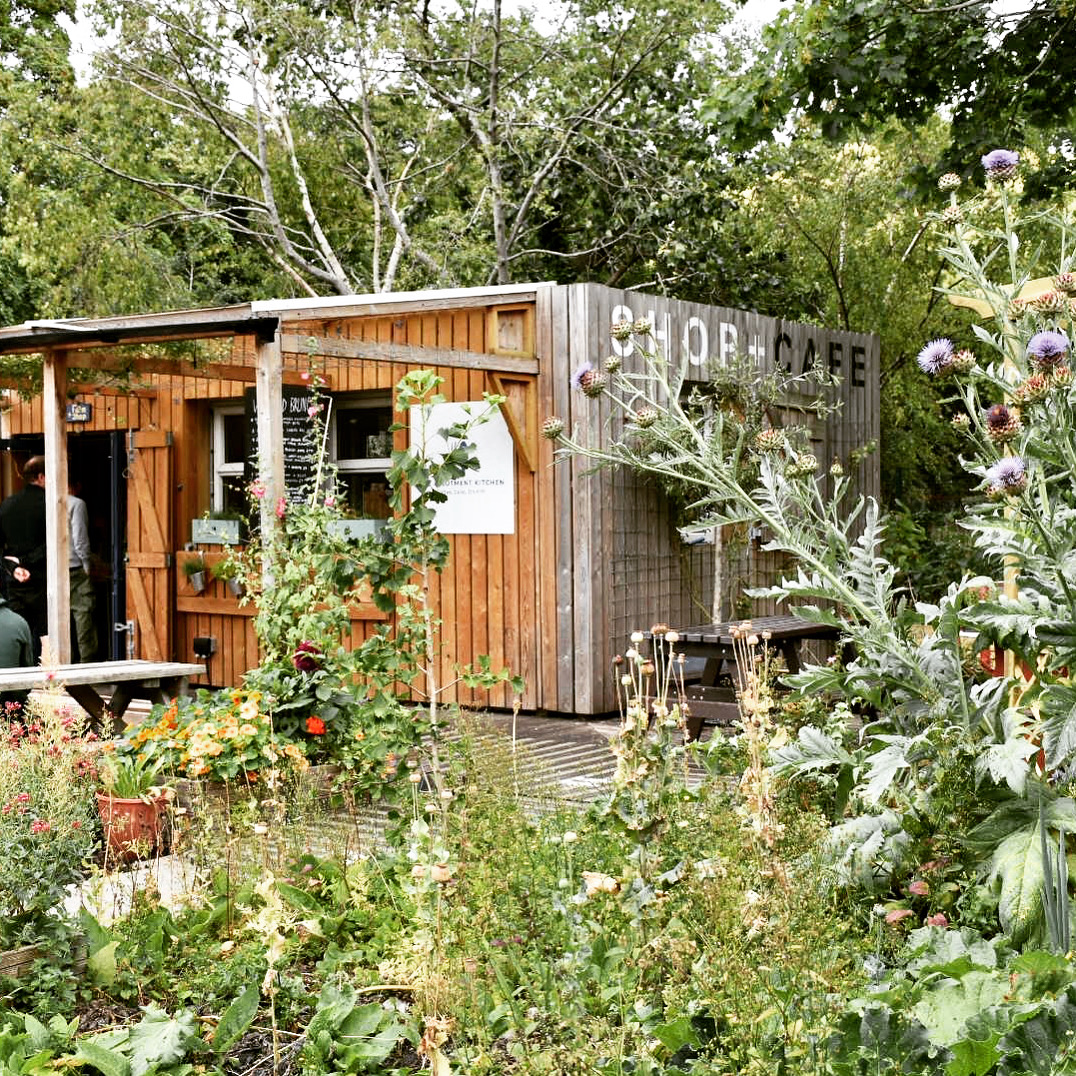 Rustic café venue with wooden structure, ideal for outdoor events and team-building.