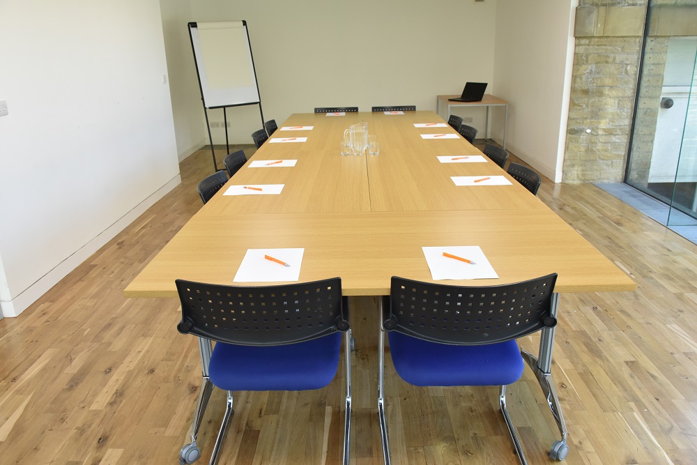 Glass meeting room at Kala Sangam Arts Centre, ideal for professional gatherings and brainstorming.