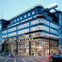 Dylan in a modern glass-fronted building, ideal for corporate meetings and events.