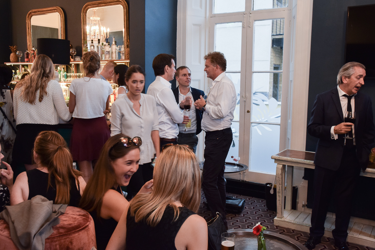 Vibrant networking event at The Lillie Lounge with active bar area and dynamic atmosphere.