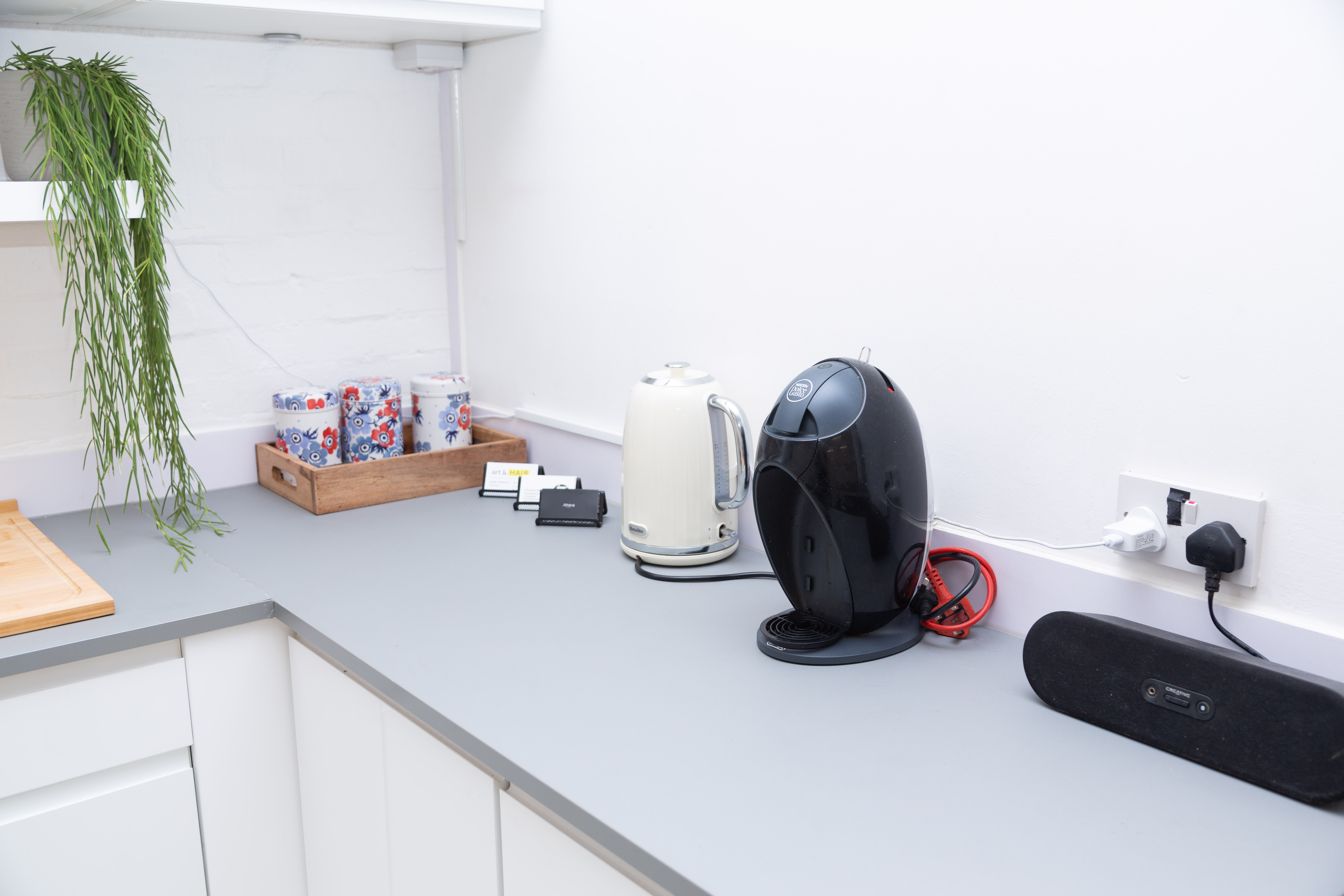 Modern refreshment station with kettle and coffee machine for meetings and events.
