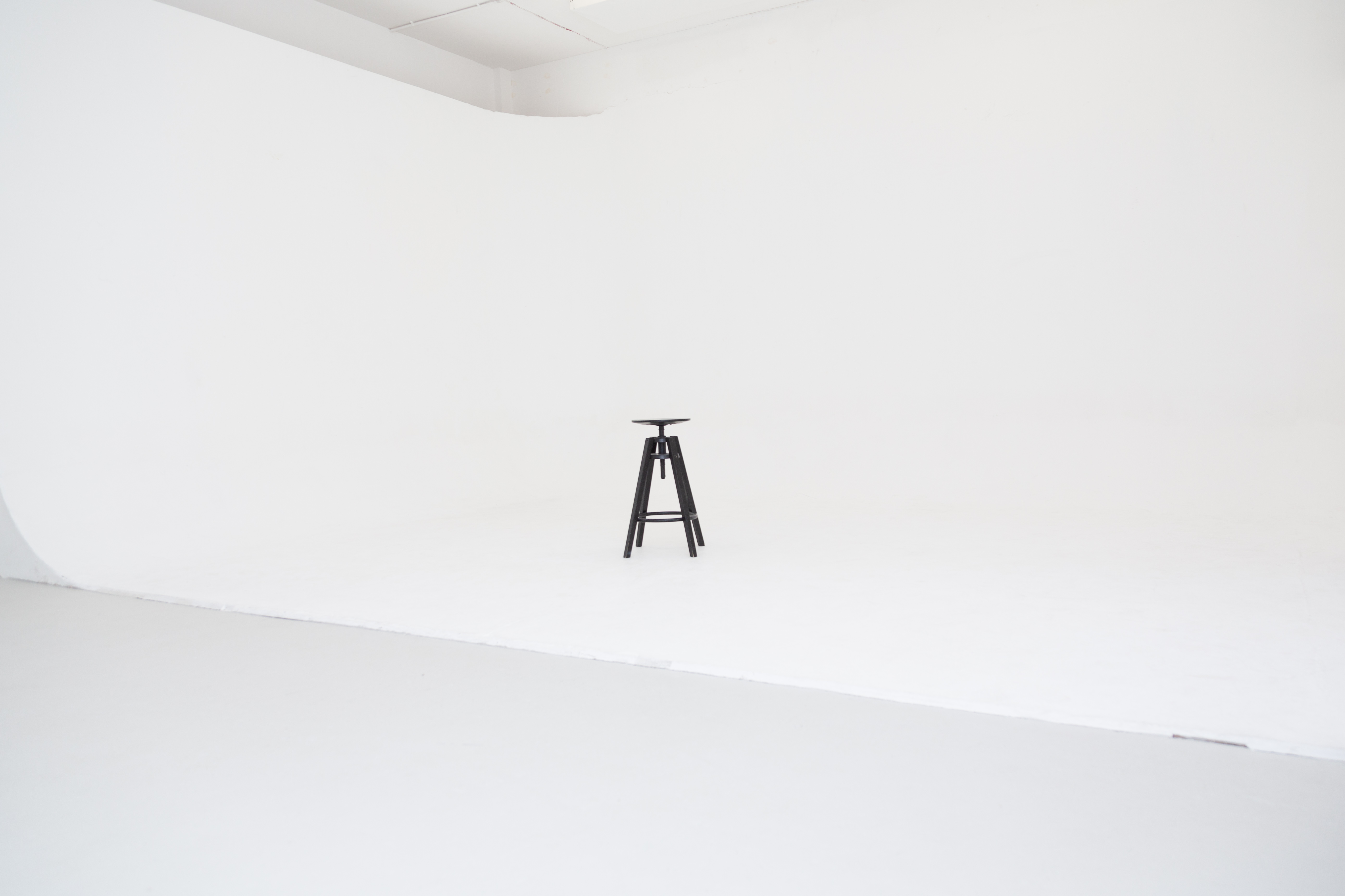 Minimalist Cove Studio setup with white backdrop for presentations and workshops.