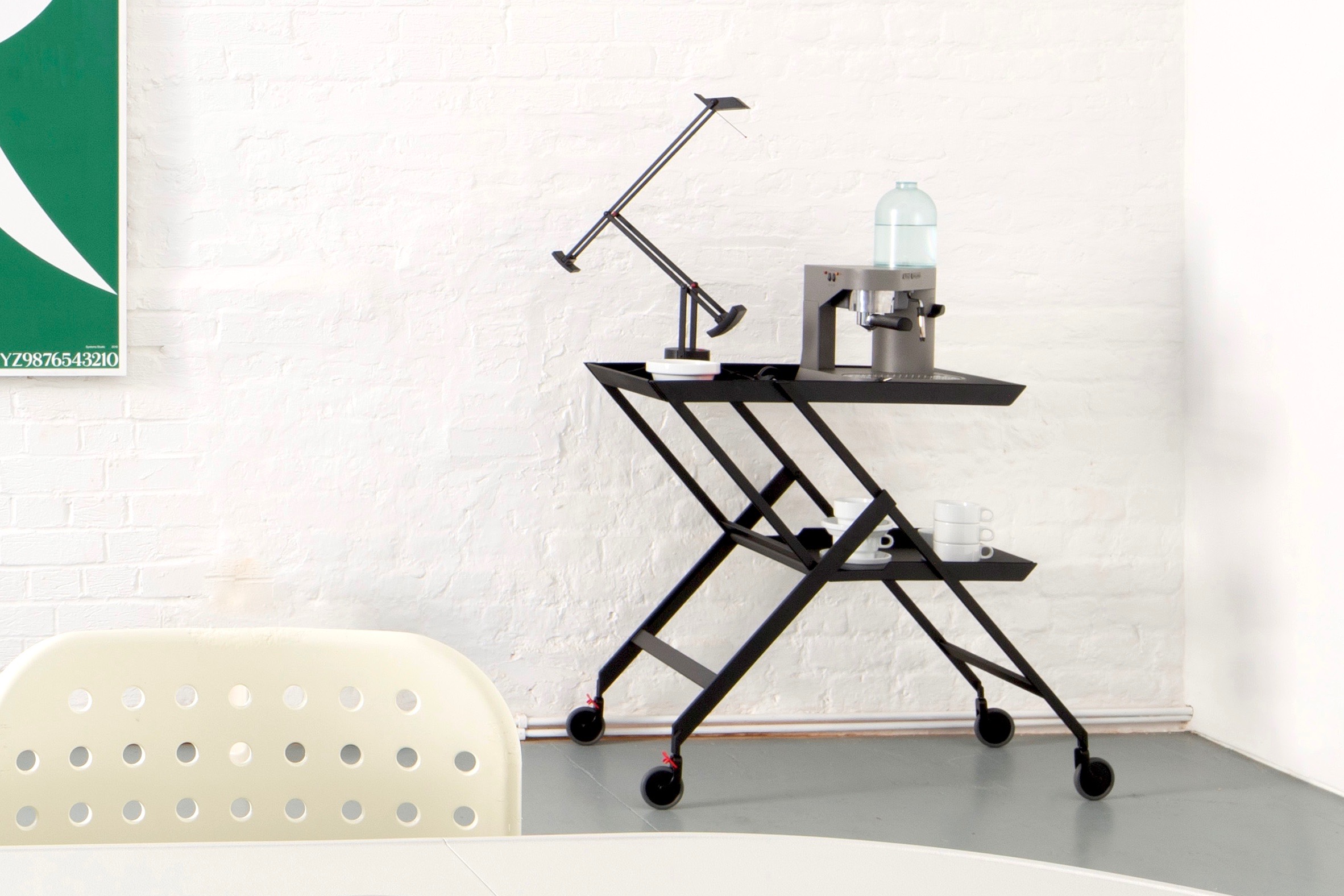 Modern serving cart with beverage dispenser, perfect for events and meetings.